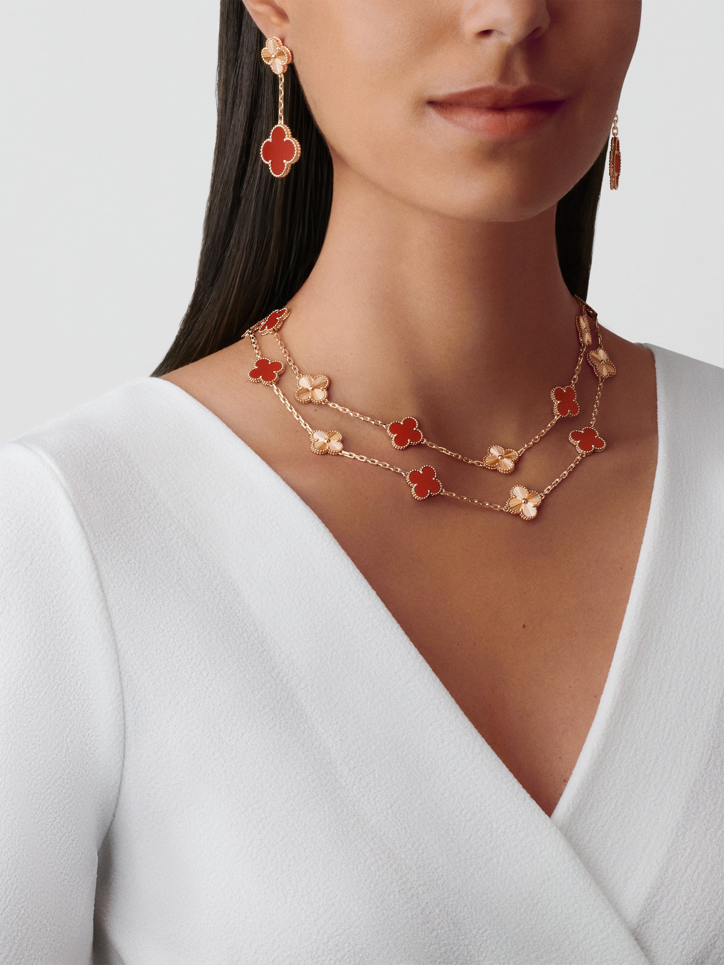 Magic Alhambra earrings, 2 motifs, 18K rose gold, Carnelian:  2 stones, Worn Detail, Jewelry Earrings - Van Cleef & Arpels