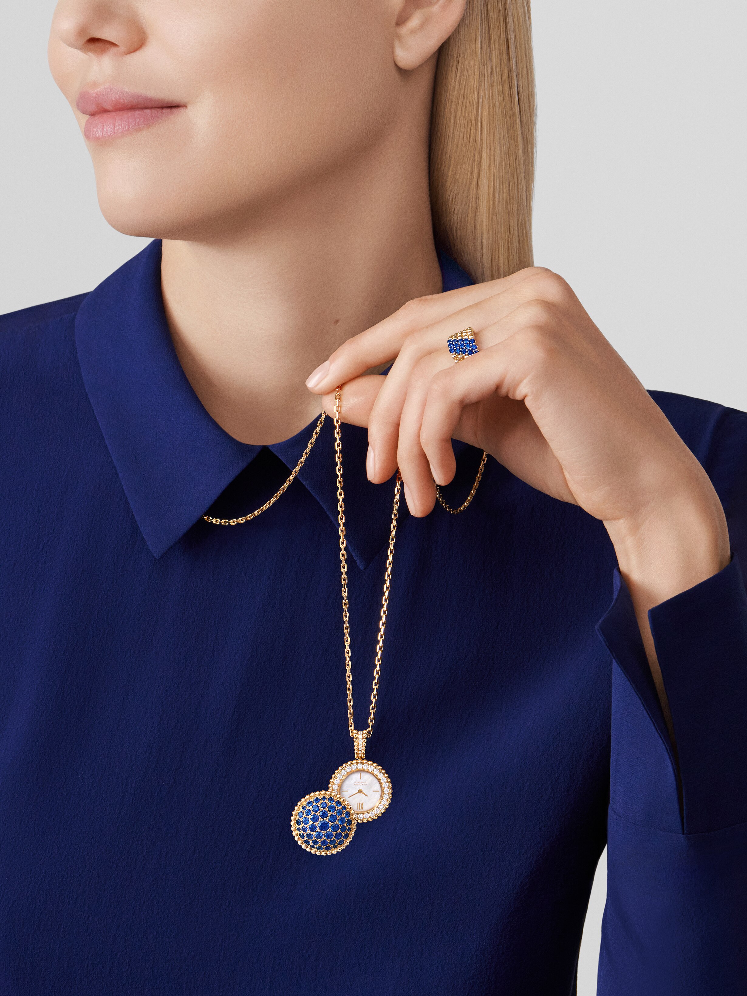 Perlée secret pendant watch, 18K yellow gold, Diamond:  40 stones,  0.92 carat, Mother-of-pearl:  1 stone, Sapphire:  43 stones,  4.53 carats, Worn Alternative, Watch - Van Cleef & Arpels