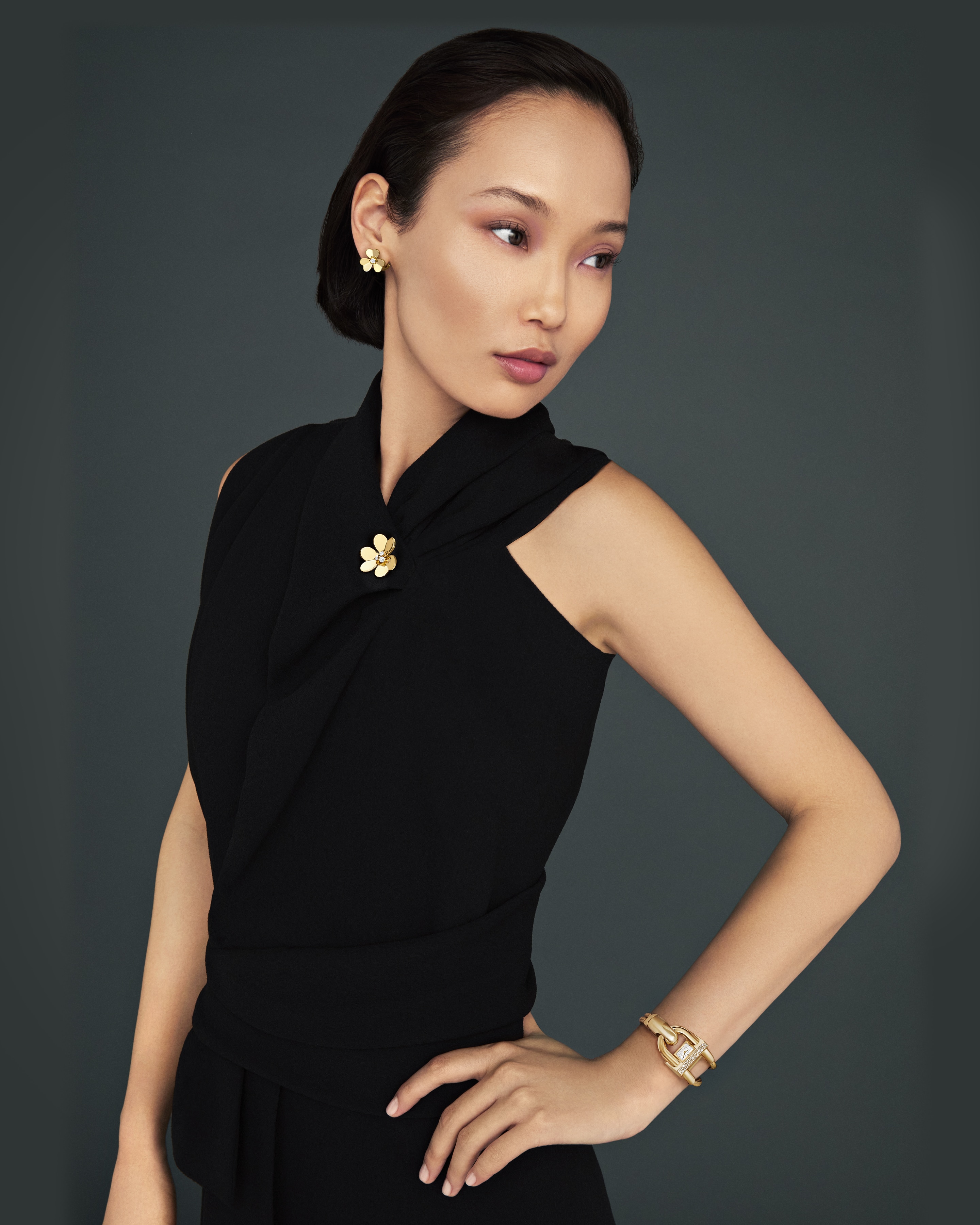 Cadenas watch, 18K yellow gold, diamonds, mother-of-pearl, quartz movement. Frivole clip pendant, very large model, 18K yellow gold, diamonds and Frivole earrings, small model, 18K yellow gold, diamonds. Cadenas and Frivole collections, Van Cleef & Arpels.