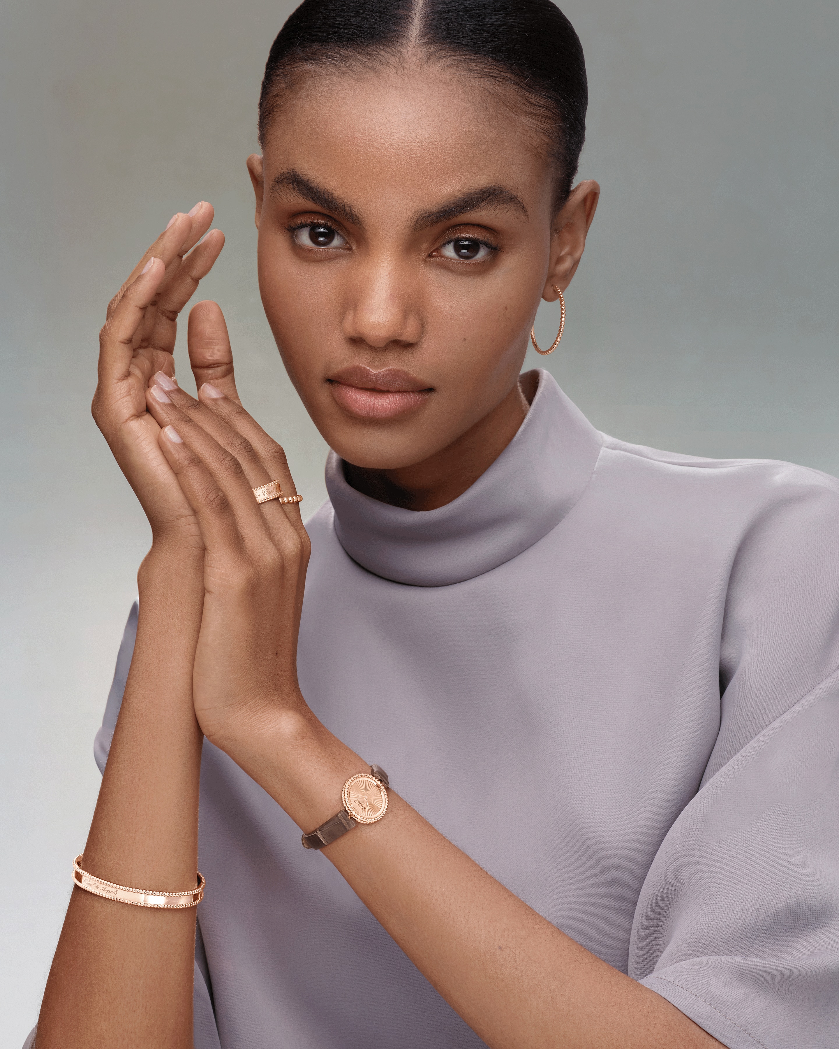 Signature bracelet and pearls of gold ring, 18K rose gold, medium model, signature ring, 18K rose gold, pearls of gold hoop earrings, small model, watch, 23 mm, 18K rose gold, guilloché 18K rose gold, Swiss quartz movement. Perlée collection, Van Cleef & Arpels.
