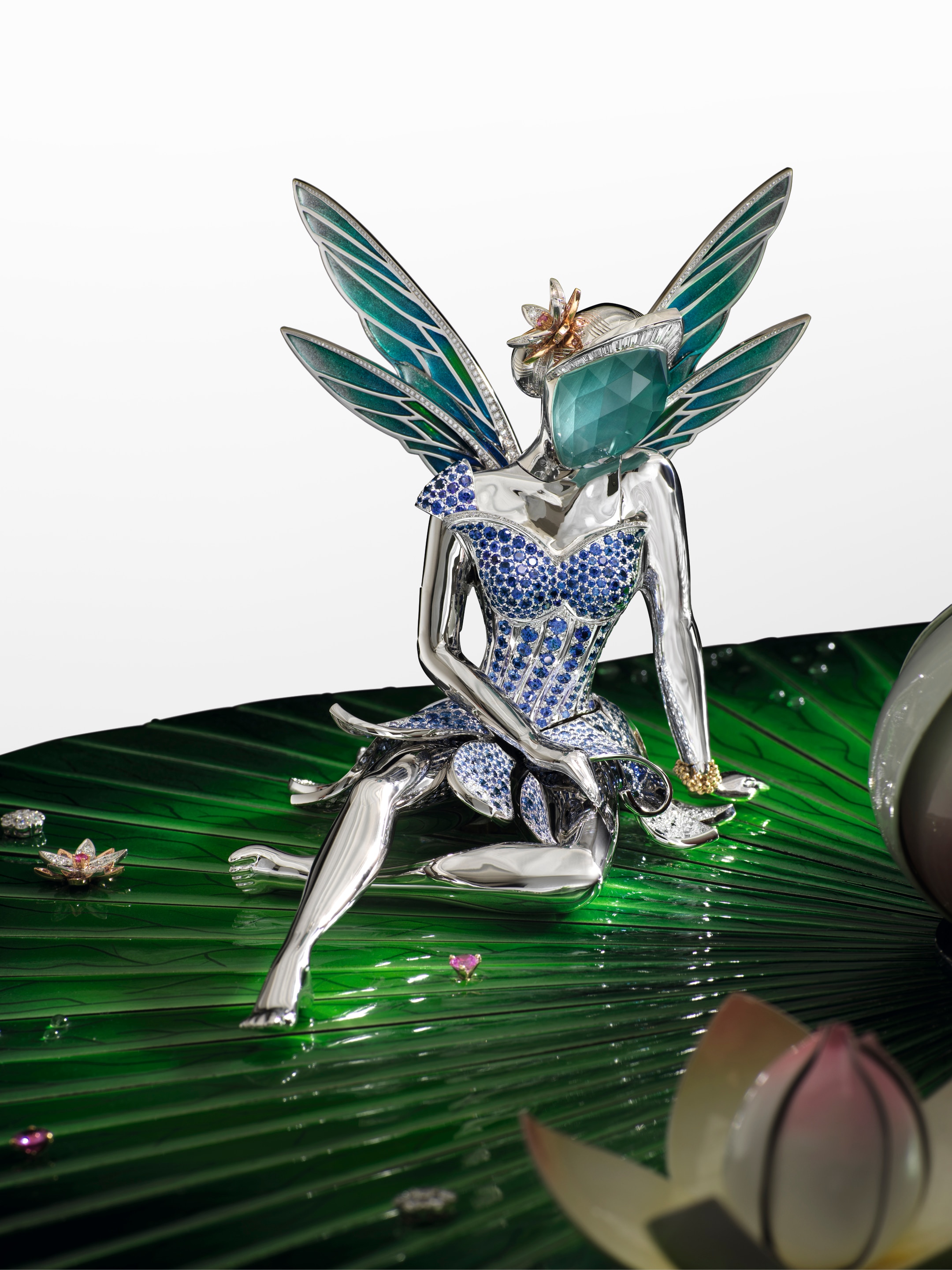 Fée Ondine automaton in white, yellow and rose gold, diamonds, blue, pink and yellow sapphires, Traditional Mystery Set rubies, spessartite garnets, aquamarine, white opal, onyx, enamel, wood marquetry, silver, aluminum. Extraordinary Objects collection, Van Cleef & Arpels.