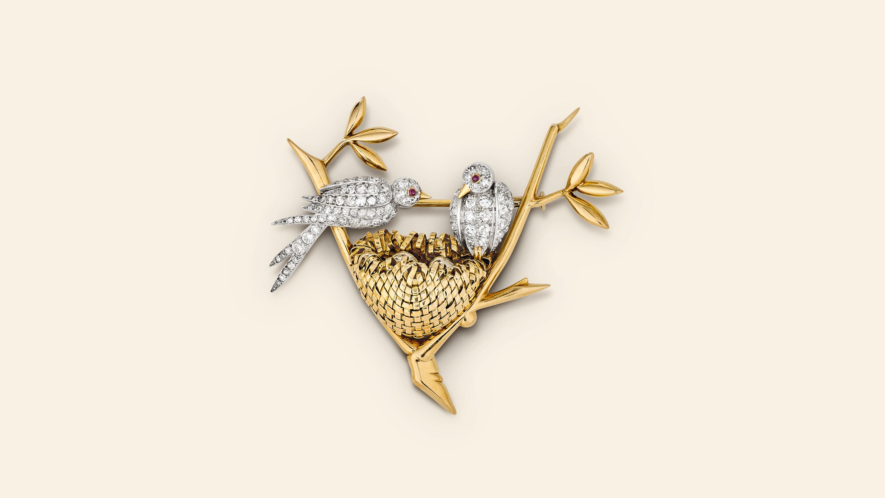 Two Birds With A Nest clip, 1945​. Yellow gold, platinum, white gold, rubies, diamonds​. Van Cleef & Arpels Collection.