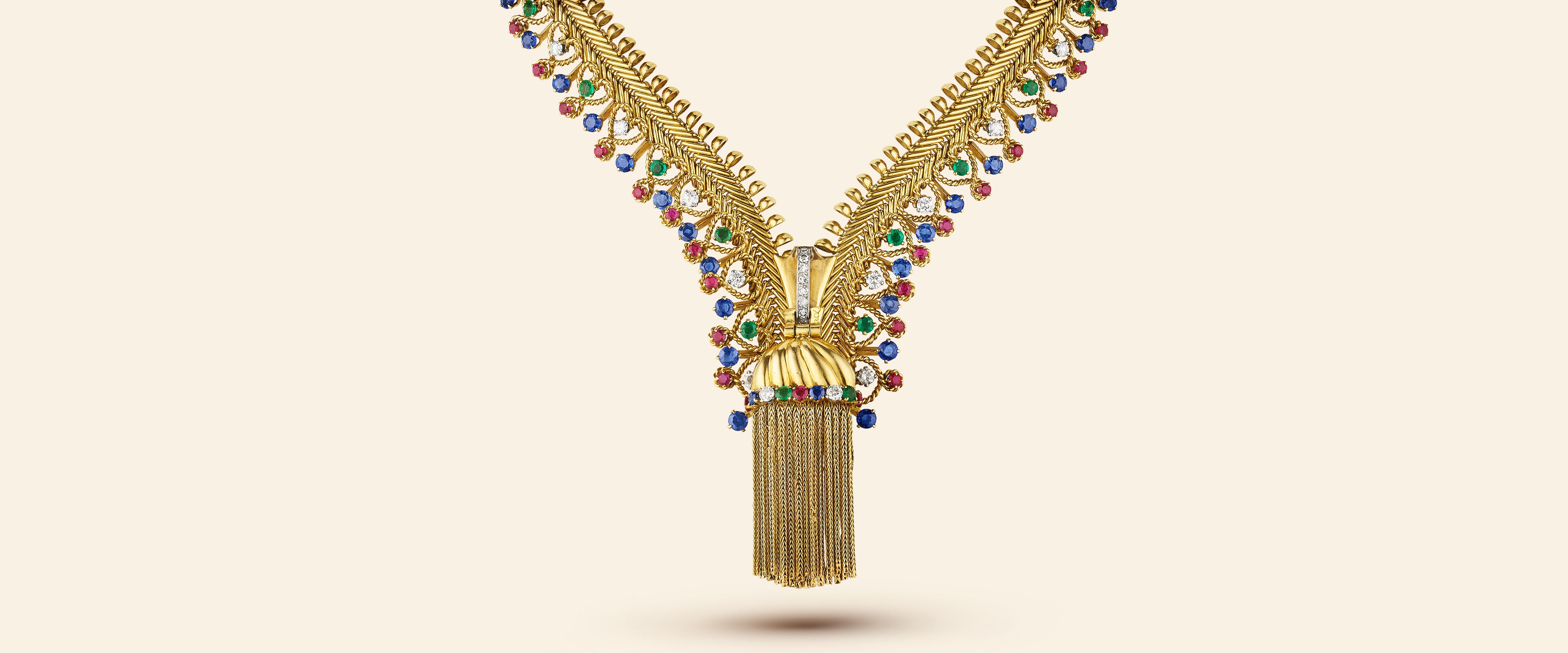 Zip necklace, 1954​. Transformable into a bracelet​. Yellow gold, platinum, emeralds, rubies, sapphires, diamonds​. Van Cleef & Arpels Collection.