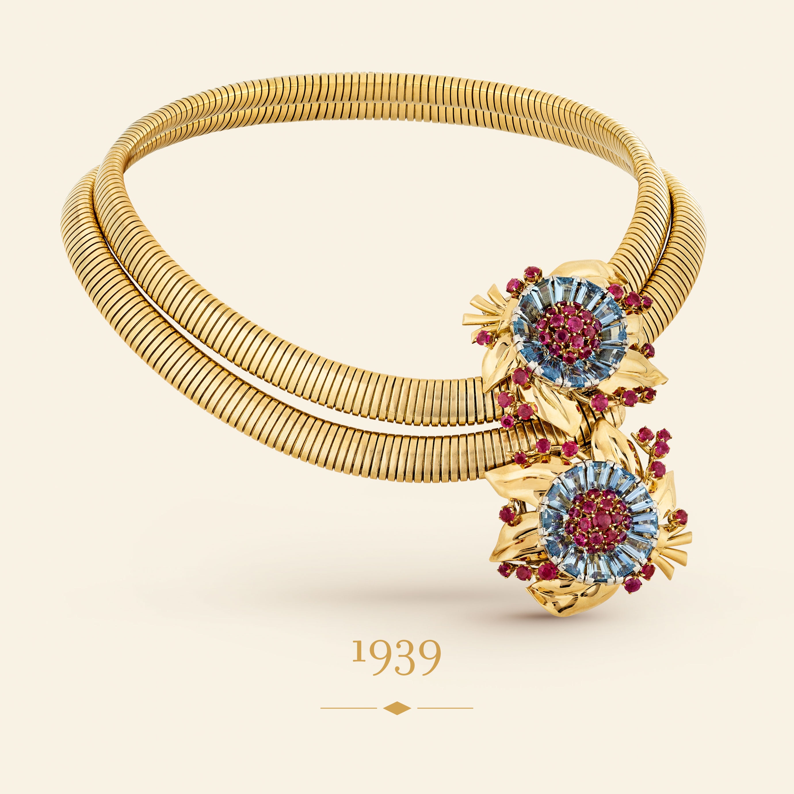 Passe-Partout jewelry, 1939​. Transformable into a necklace, a bracelet, a belt or detachable clips​. Platinum, yellow gold, white gold, rose gold, rubies, aquamarines​. Van Cleef & Arpels Collection.