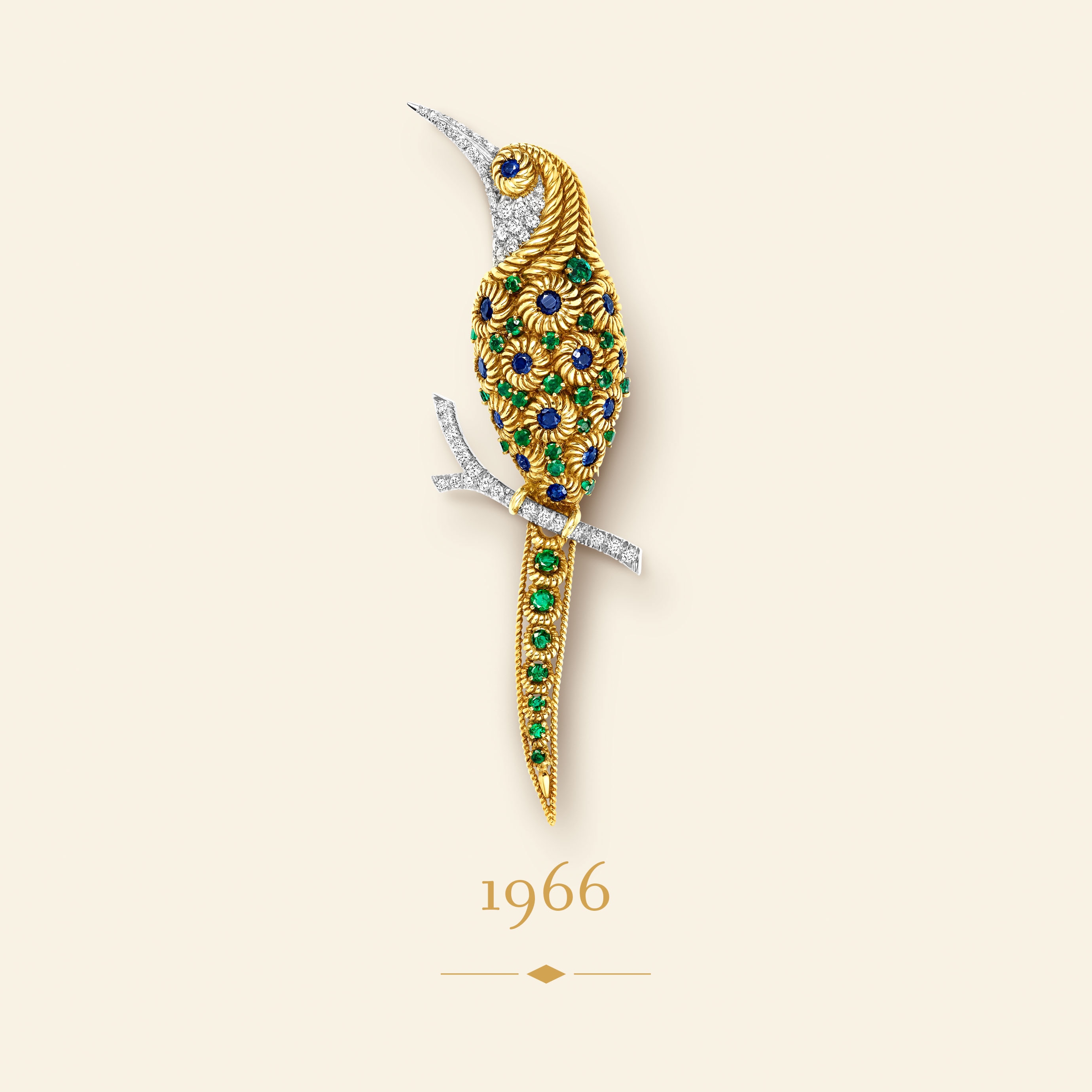 Bird clip, 1966​. Yellow gold, white gold, emeralds, sapphires, diamonds​. Van Cleef & Arpels Collection.