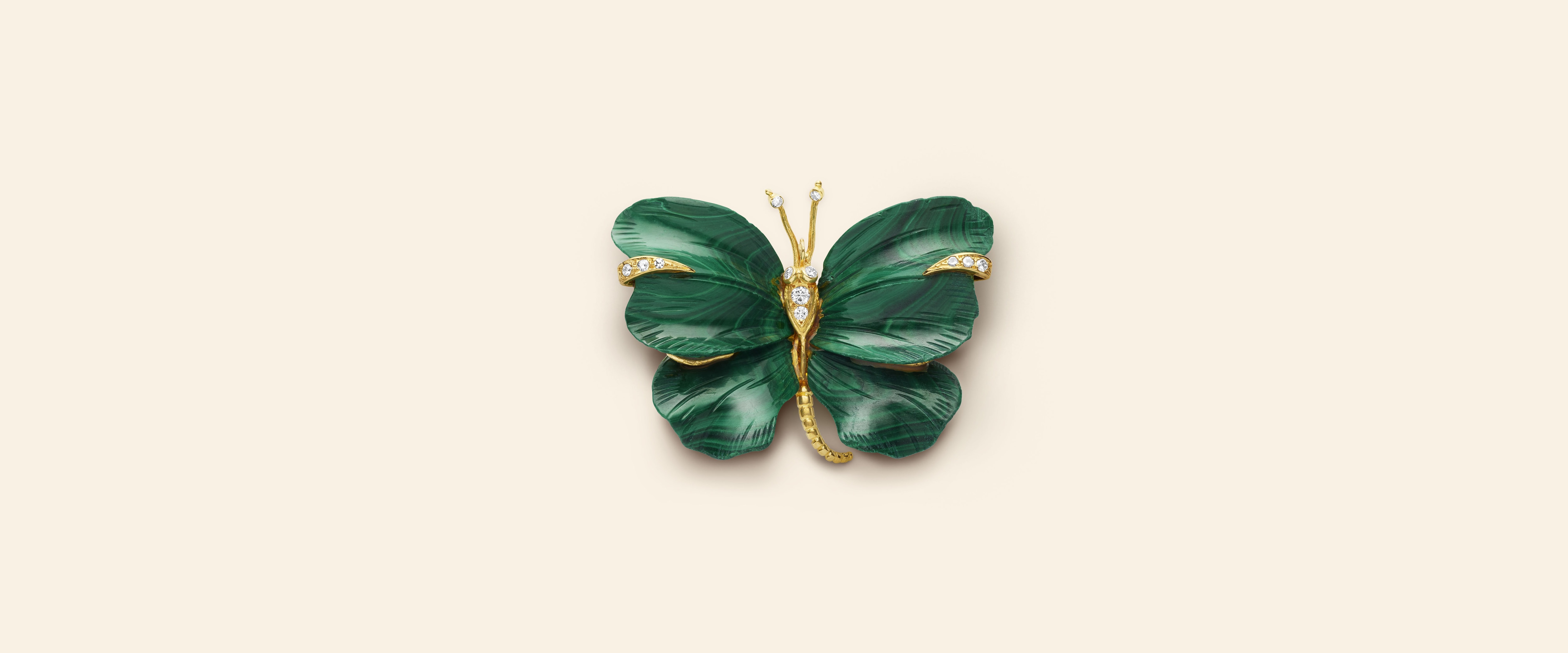 Butterfly clip, circa 1971​. Yellow gold, white gold, malachite, diamonds​. Van Cleef & Arpels Collection.