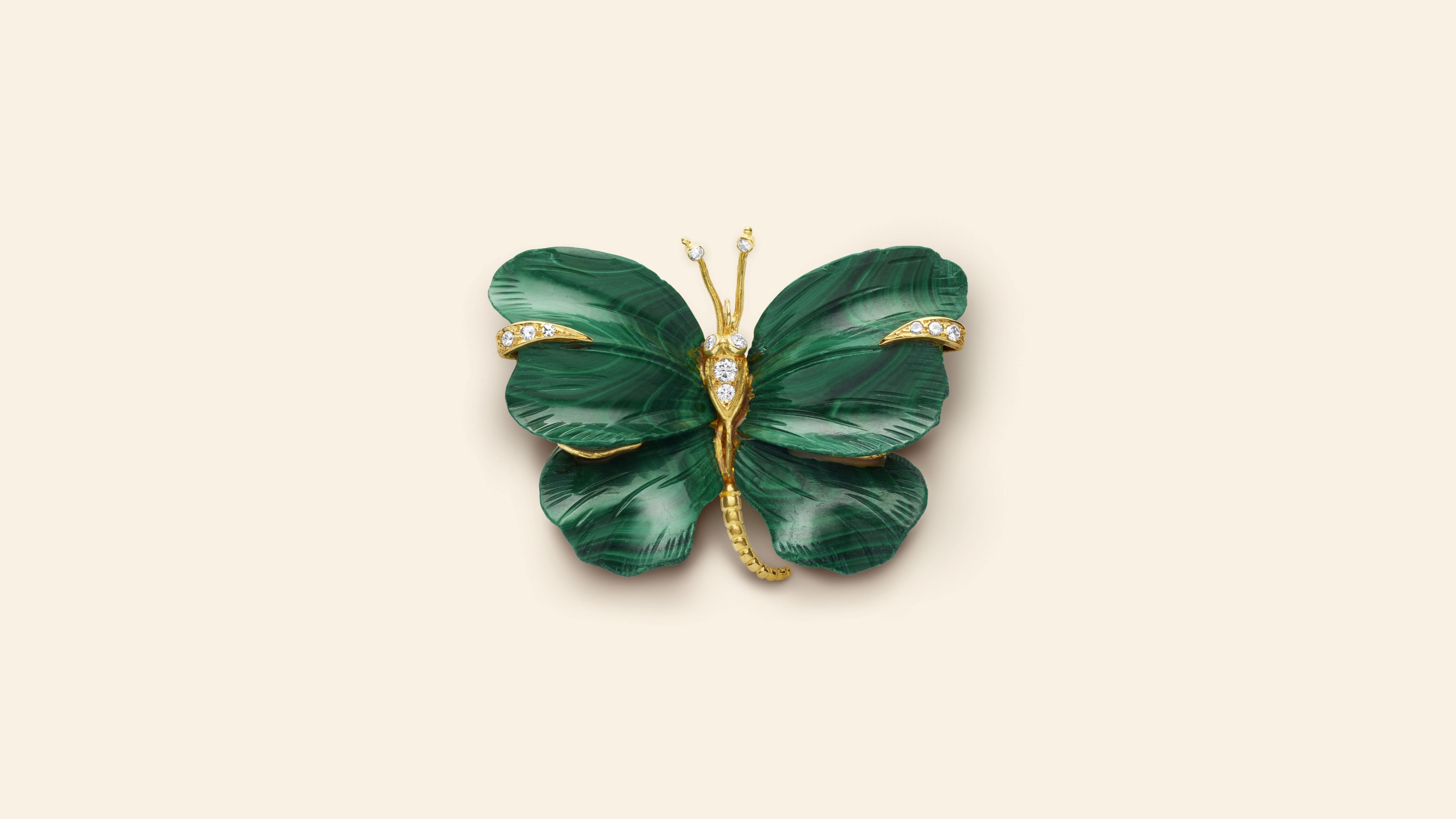 Butterfly clip, circa 1971​. Yellow gold, white gold, malachite, diamonds​. Van Cleef & Arpels Collection.