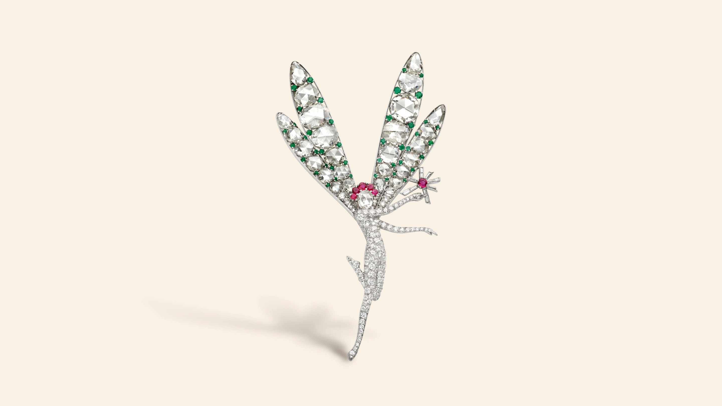 Little Winged Fairy clip, later named Spirit of Beauty, 1941​. Platinum, emeralds, rubies, diamonds​. Purchased by the American socialite Barbara Hutton for a friend. Van Cleef & Arpels Collection​.
