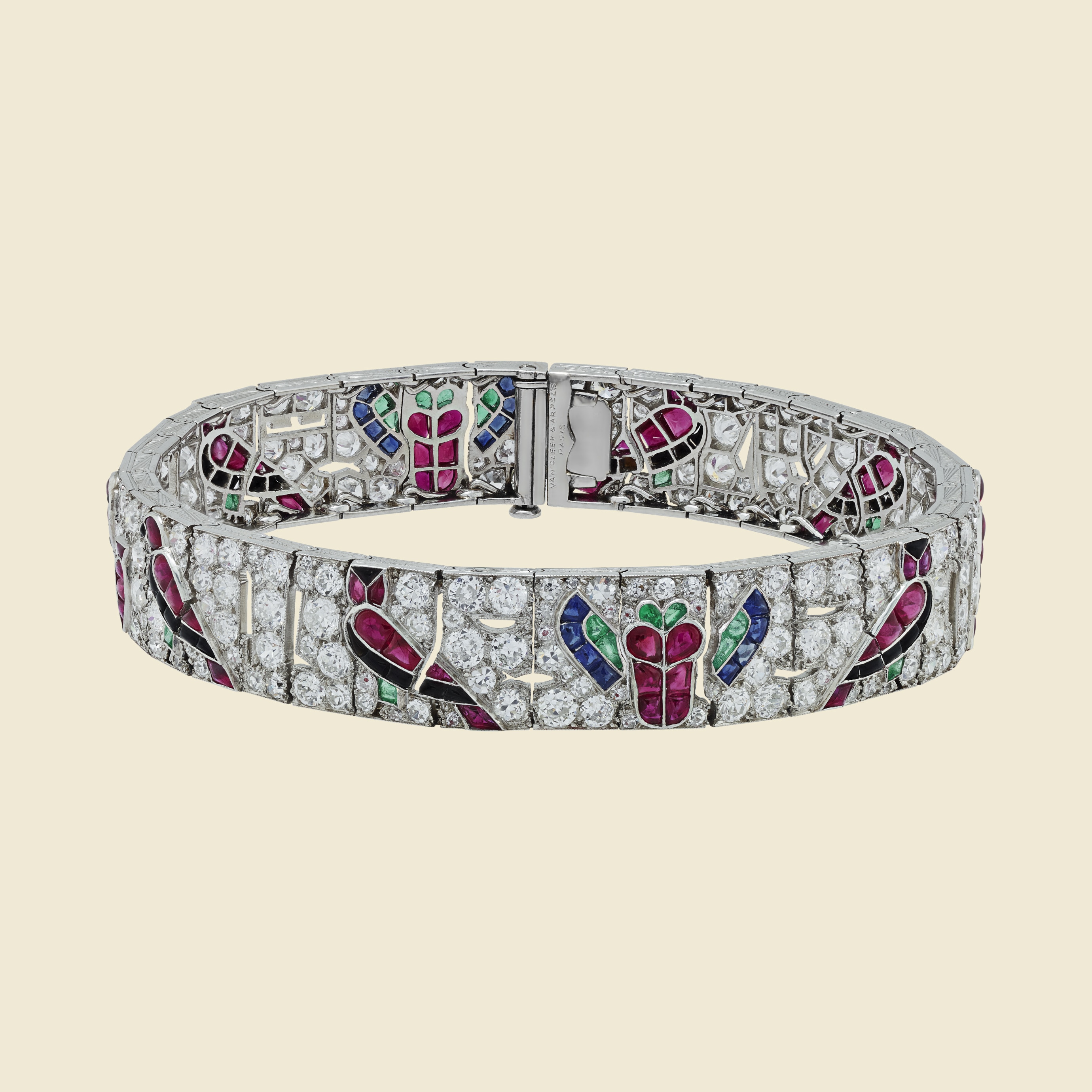 Egyptian-inspired bracelet, 1924, platinum, sapphires, rubies, emeralds, onyx, diamonds. Van Cleef & Arpels.