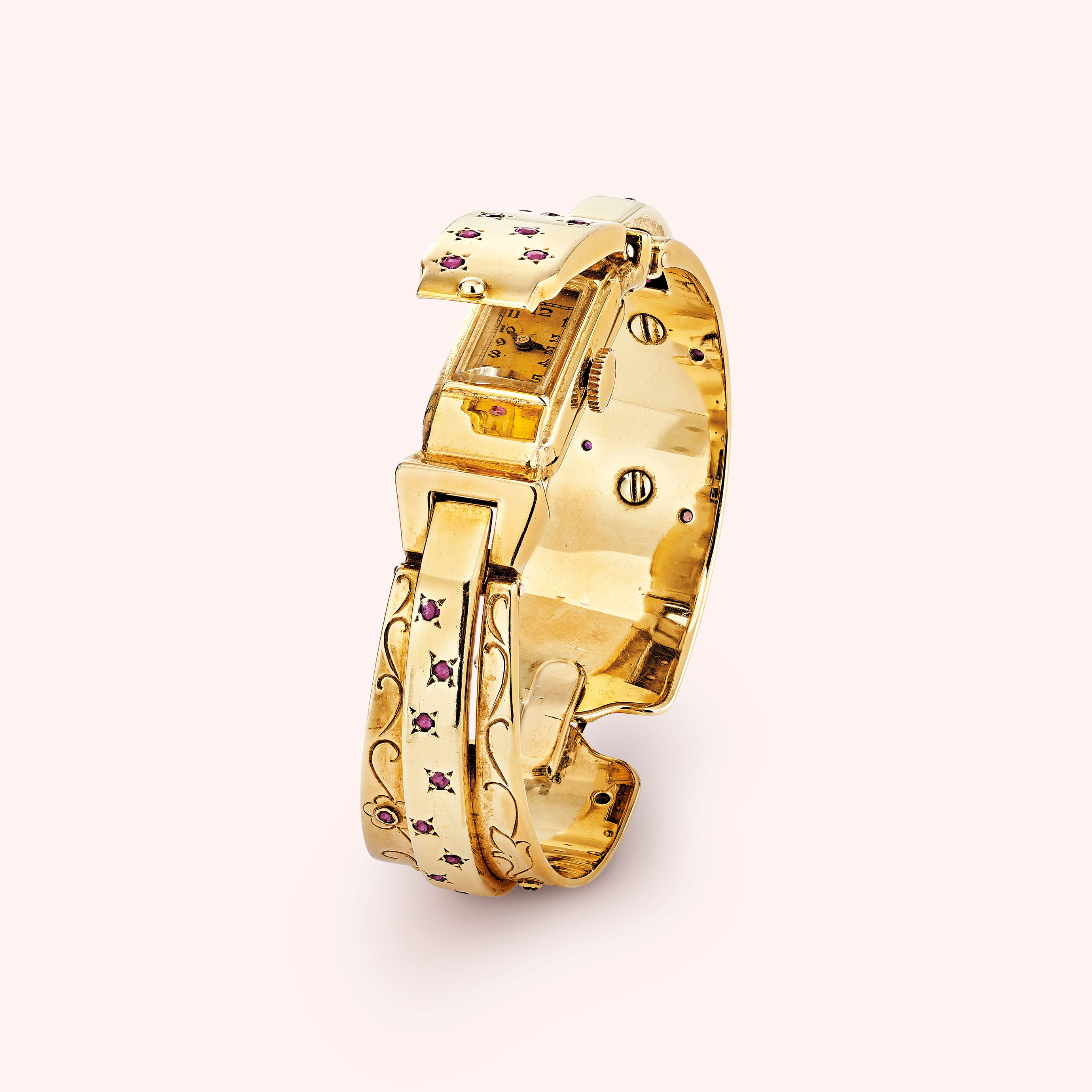 Secret wristwatch, 1942, yellow gold, rubies. Van Cleef & Arpels Collection.