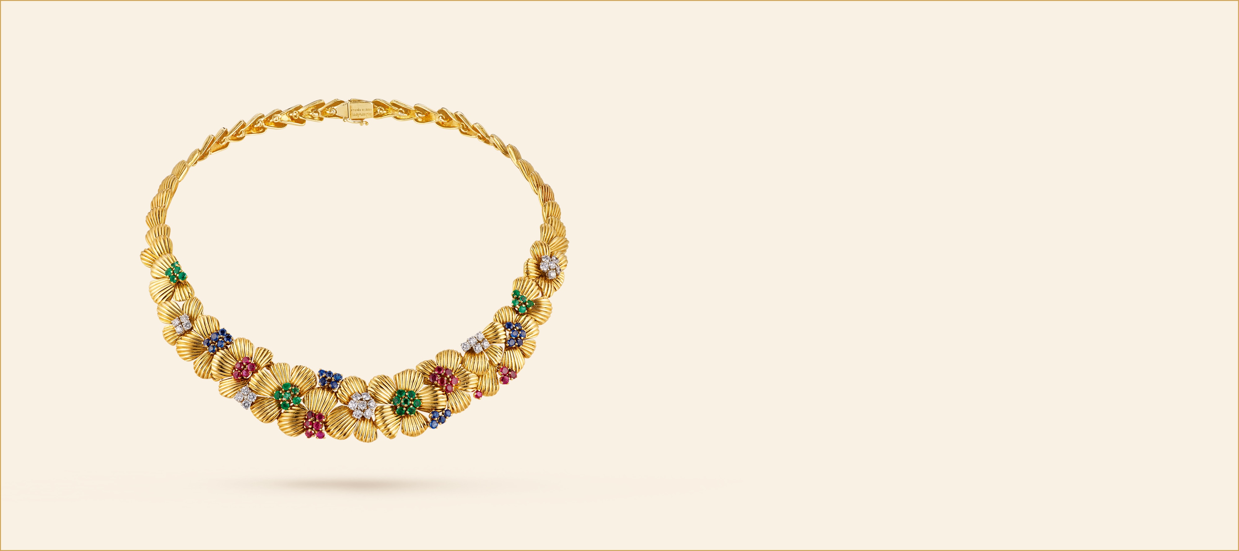 Little Flower项链，1950年-1954年。黄K金，祖母绿，红宝石，蓝宝石，钻石。Van Cleef & Arpels梵克雅宝典藏。