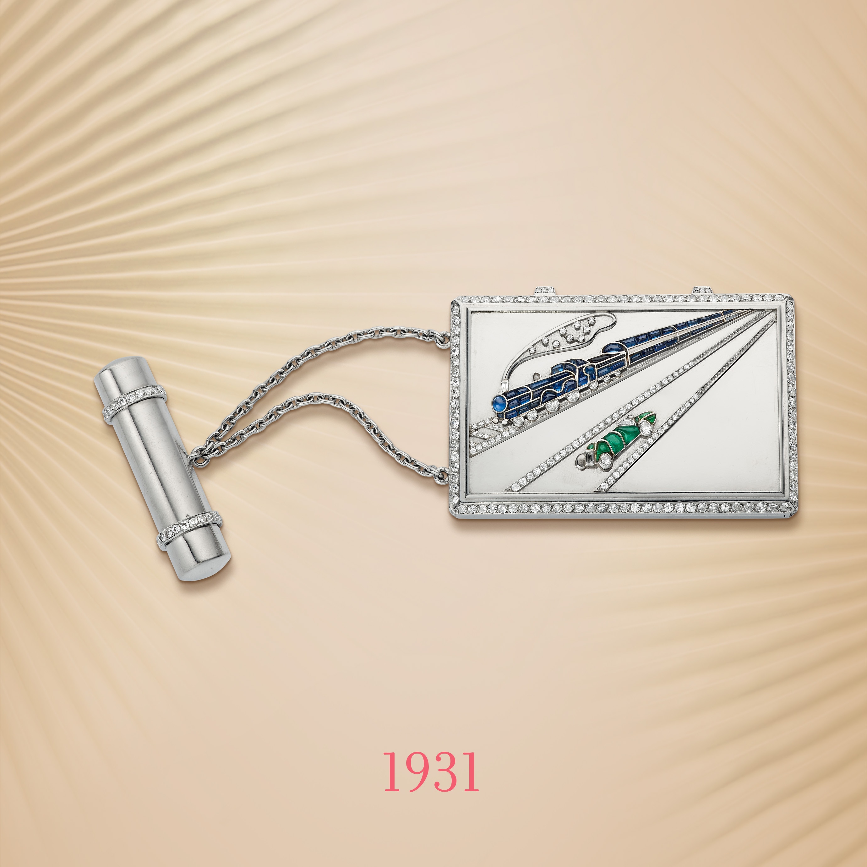 Blue train powder case, circa 1931. Platinum, 18K yellow gold, emeralds, sapphires, diamonds. Special order from Babe Barnato, the Chairman of Bentley cars. Van Cleef & Arpels Collection.