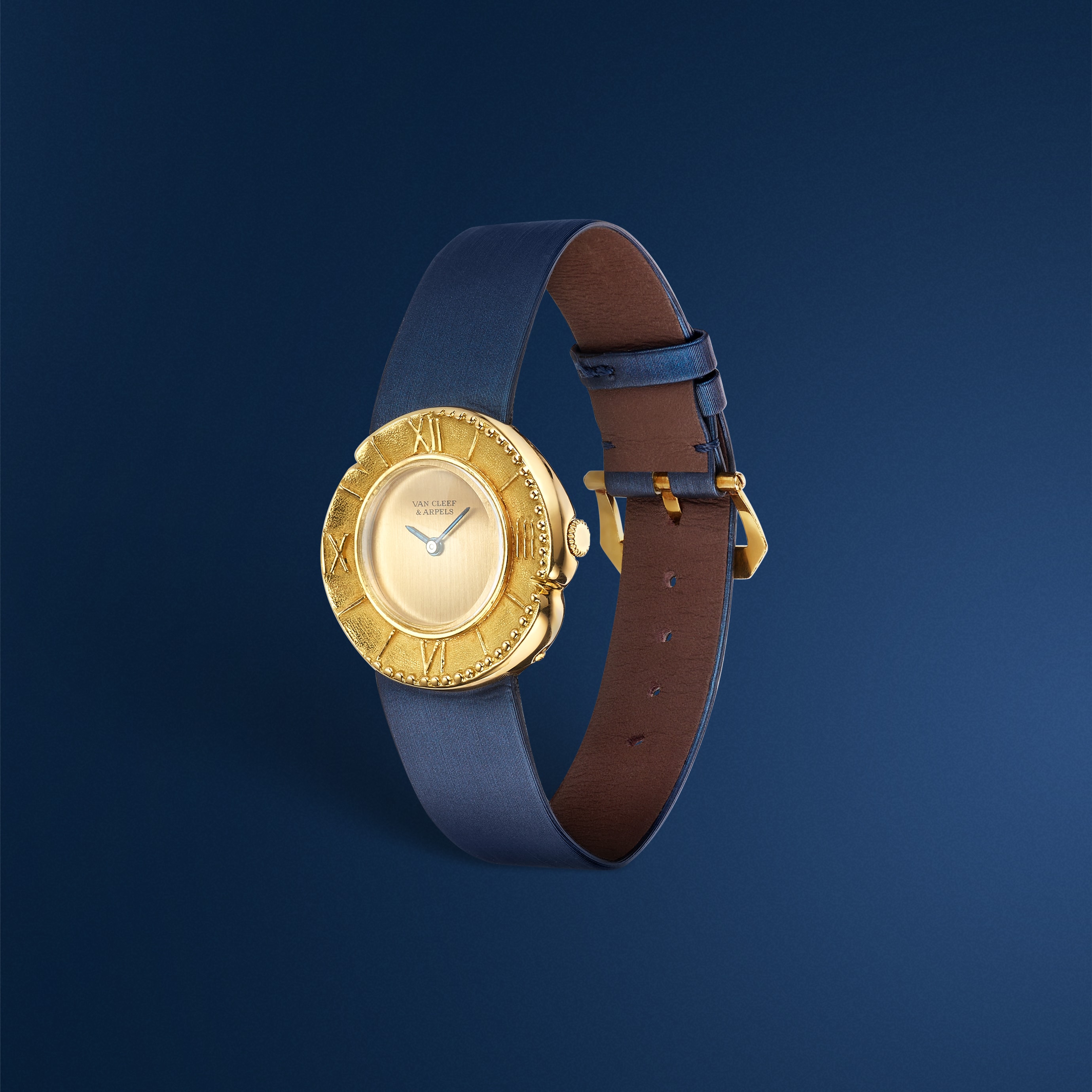 Ancient Stamping wristwatch, 1961 Yellow gold Van Cleef & Arpels Collection