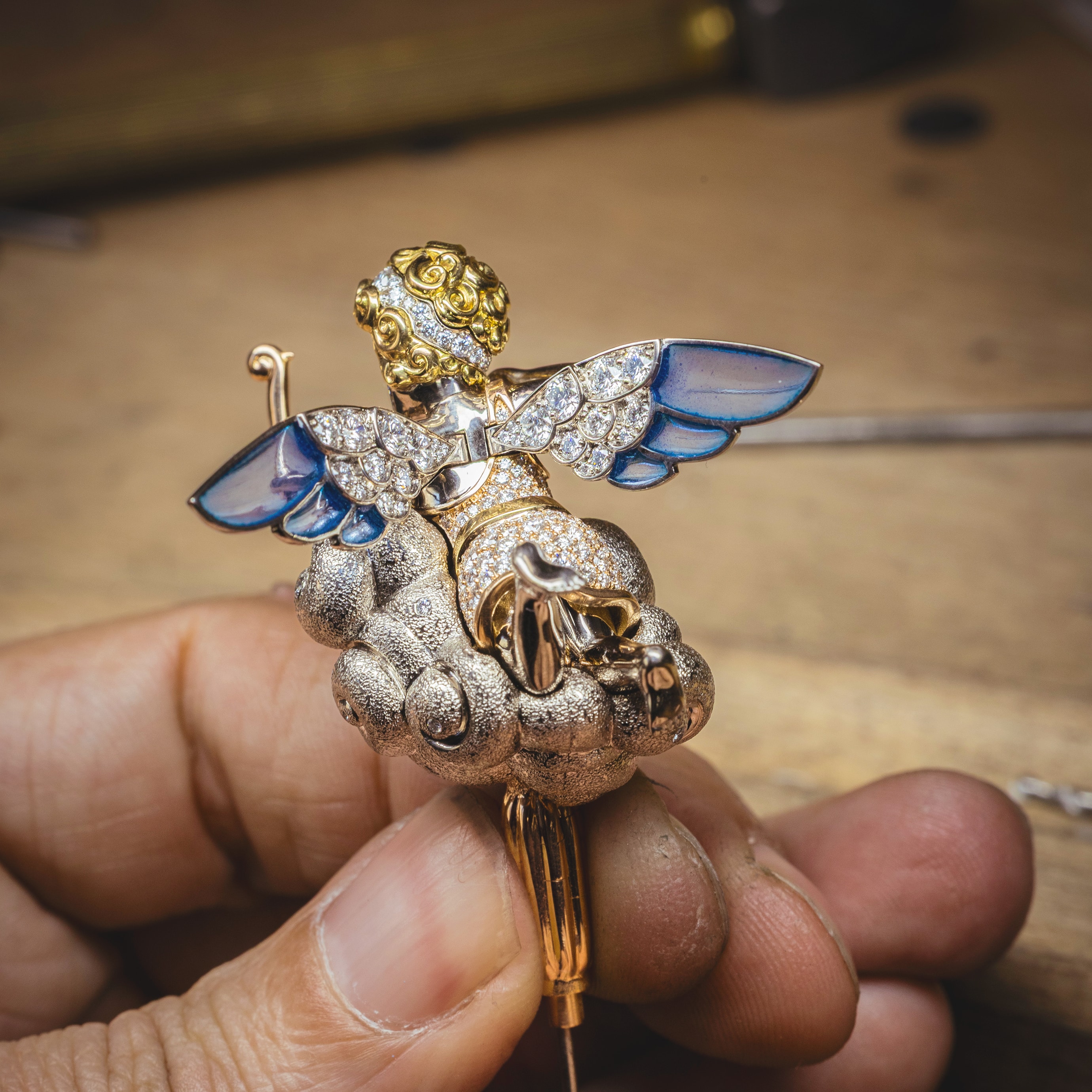Testing the movement of Cupid's wings, Van Cleef & Arpels.