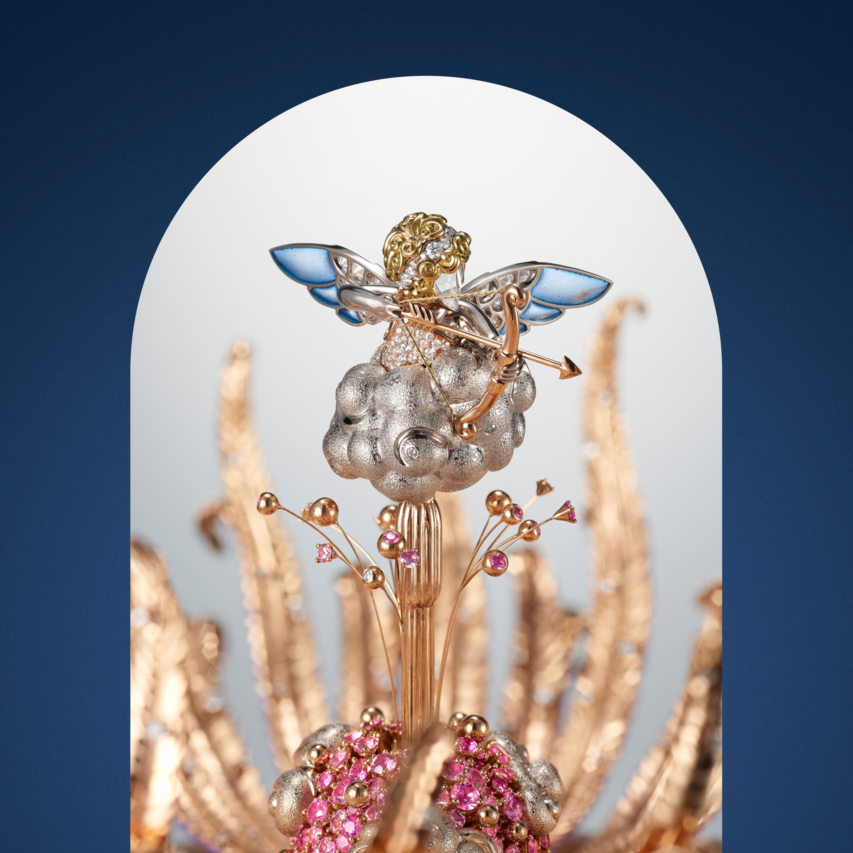 Naissance de l’Amour automaton, rose, white and yellow gold, pink sapphires, diamonds, iron eye, petrified palm tree, enamel, lacquer, ebony, leather, aluminium, steel. Automaton and mechanical movements, 12-hour function on a 360-degree rotating ring, 8-day power reserve, on-demand animation with a melody. Extraordinary Objects™ collection, Van Cleef & Arpels.