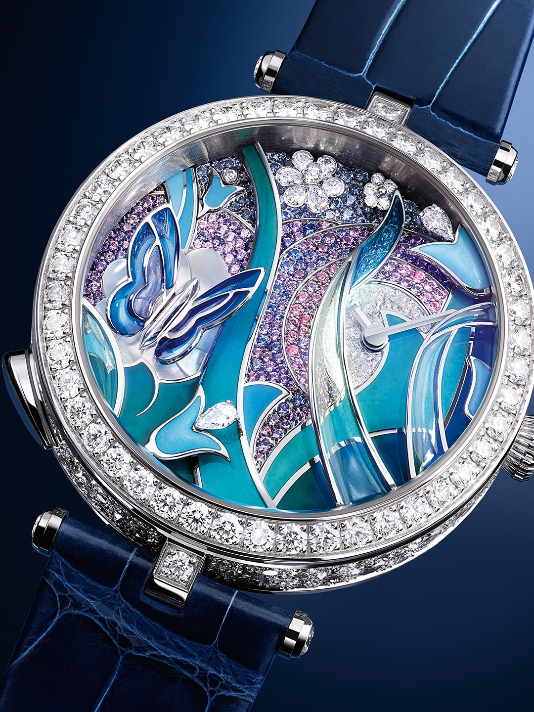 Lady Arpels Papillon Automate watch. 18K white gold, blue, mauve and purple sapphires, mother-of-pearl, champlevé, paillonné, plique-à-jour and curved plique-à-jour enamel and miniature painting, diamonds. Automatic mechanical movement, equipped with a random automaton module and animation on demand. Poetic Complications® collection, Van Cleef & Arpels.