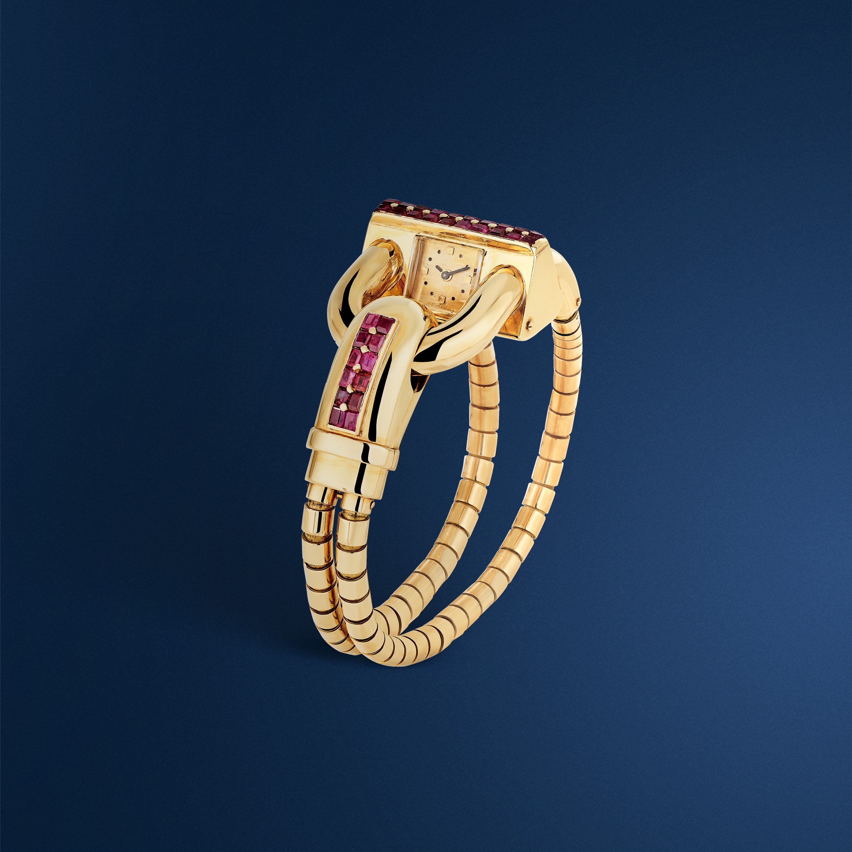 Bracelet montre Cadenas, 1942. Or jaune, rubis. Collection Van Cleef & Arpels.