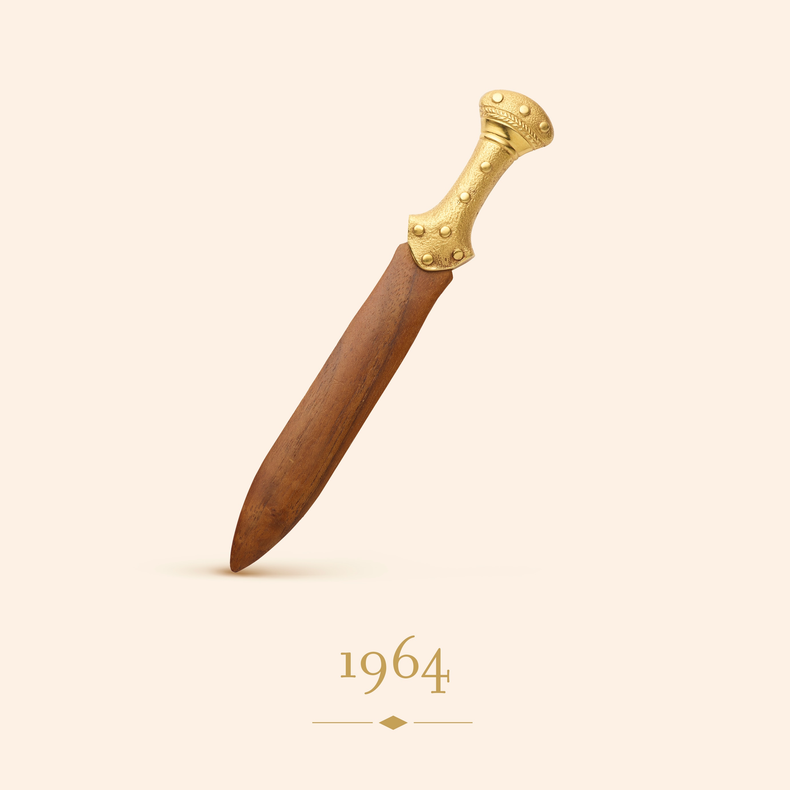 Paper knife, 1964. 18K yellow gold, crabwood. Van Cleef & Arpels Collection.