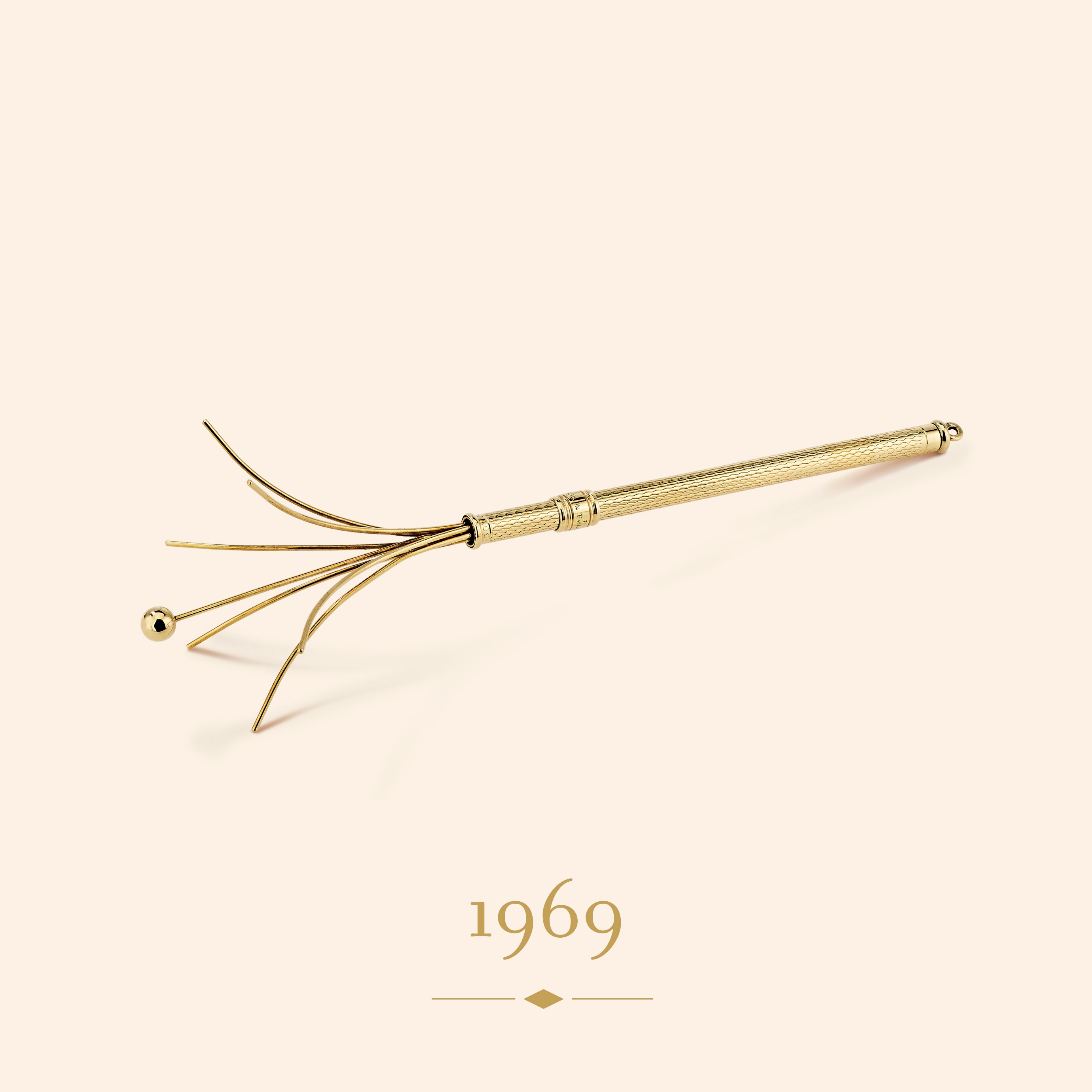 Champagne swizzle, circa 1969. 18K yellow gold. Van Cleef & Arpels Collection.
