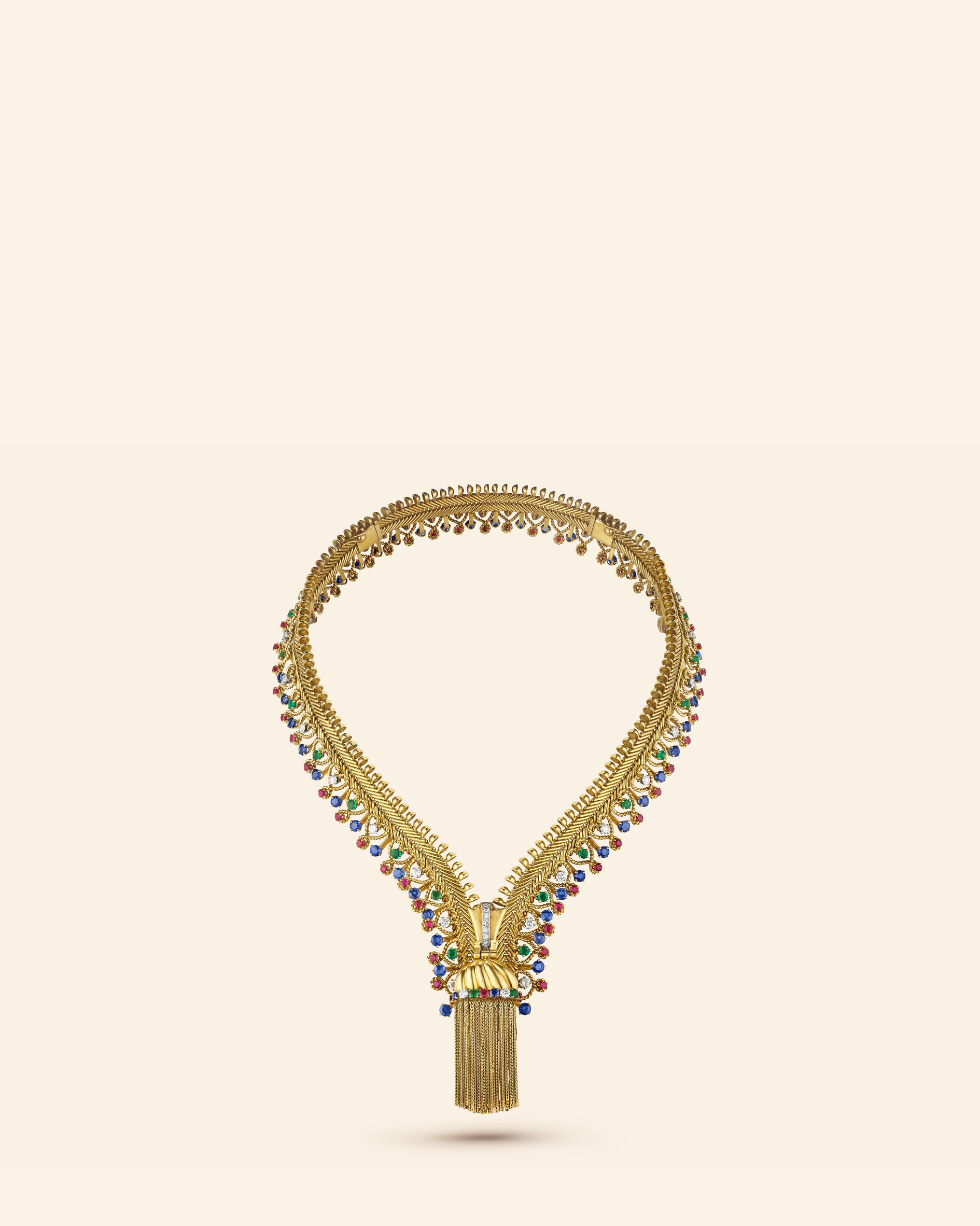 Zip necklace, 1954​. Transformable into a bracelet​. Yellow gold, platinum, emeralds, rubies, sapphires, diamonds​. Van Cleef & Arpels Collection.
