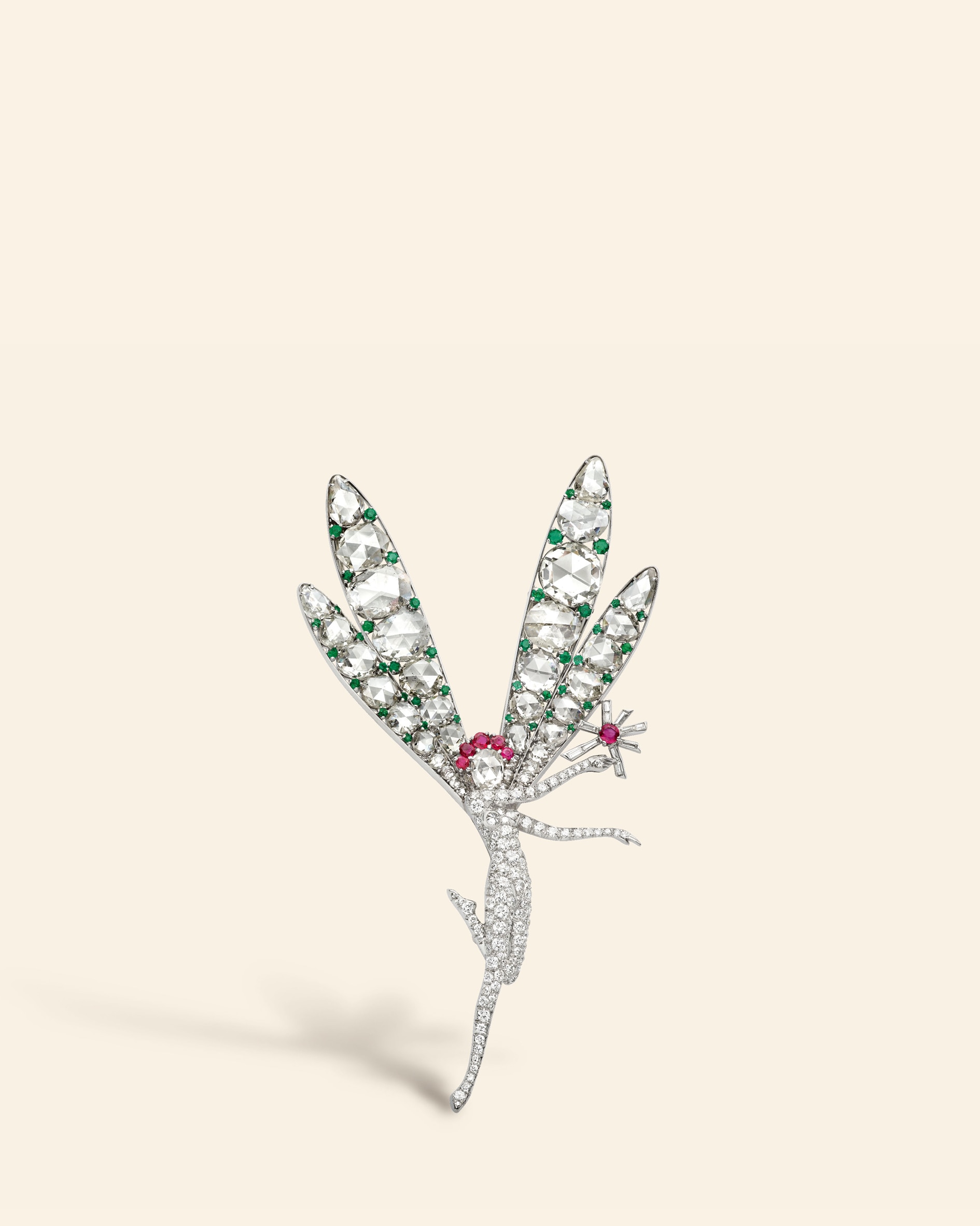 Little Winged Fairy clip, later named Spirit of Beauty, 1941​. Platinum, emeralds, rubies, diamonds​. Van Cleef & Arpels Collection​.