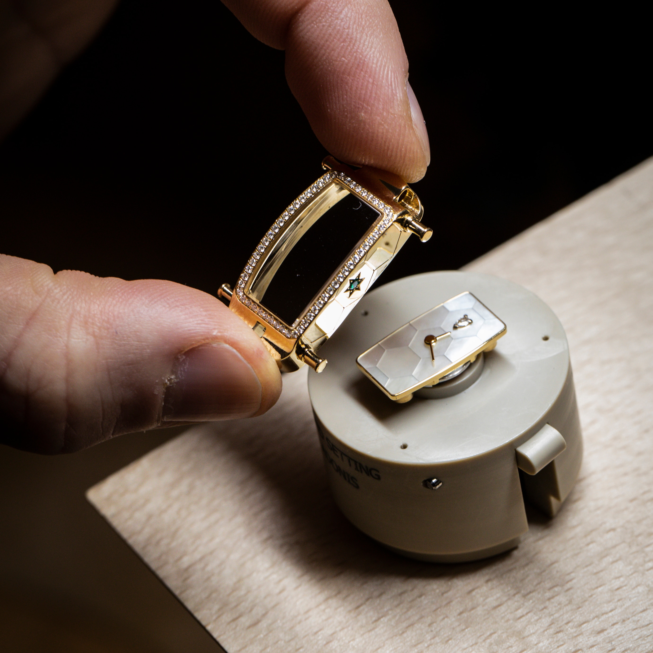 Setting of the bezel on the Ludo Secret Emeralds Mystery Set watch, Van Cleef & Arpels.