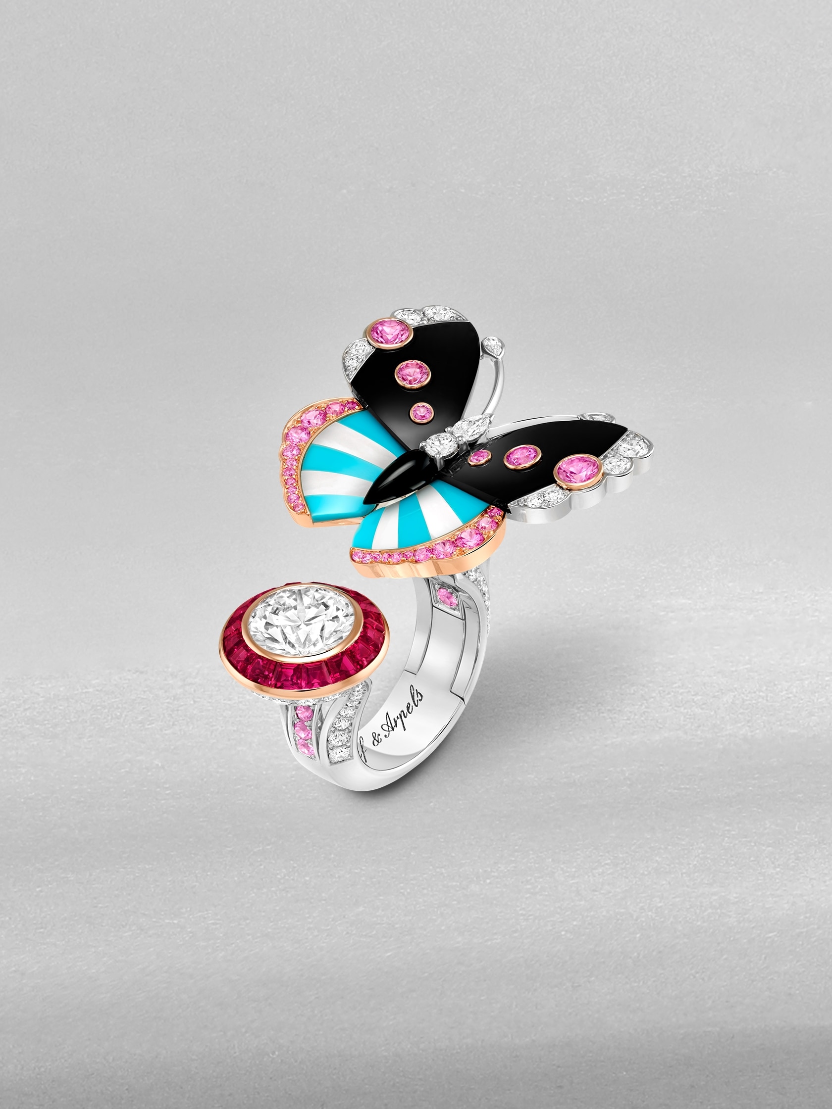 Philenor Butterfly Between the Finger ring. White gold, rose gold, 2.5 carat EVVS2 diamond, rubies, pink, sapphires, onyx, turquoise, white mother-of-pearl, diamonds. High Jewelry collection, Van Cleef & Arpels.