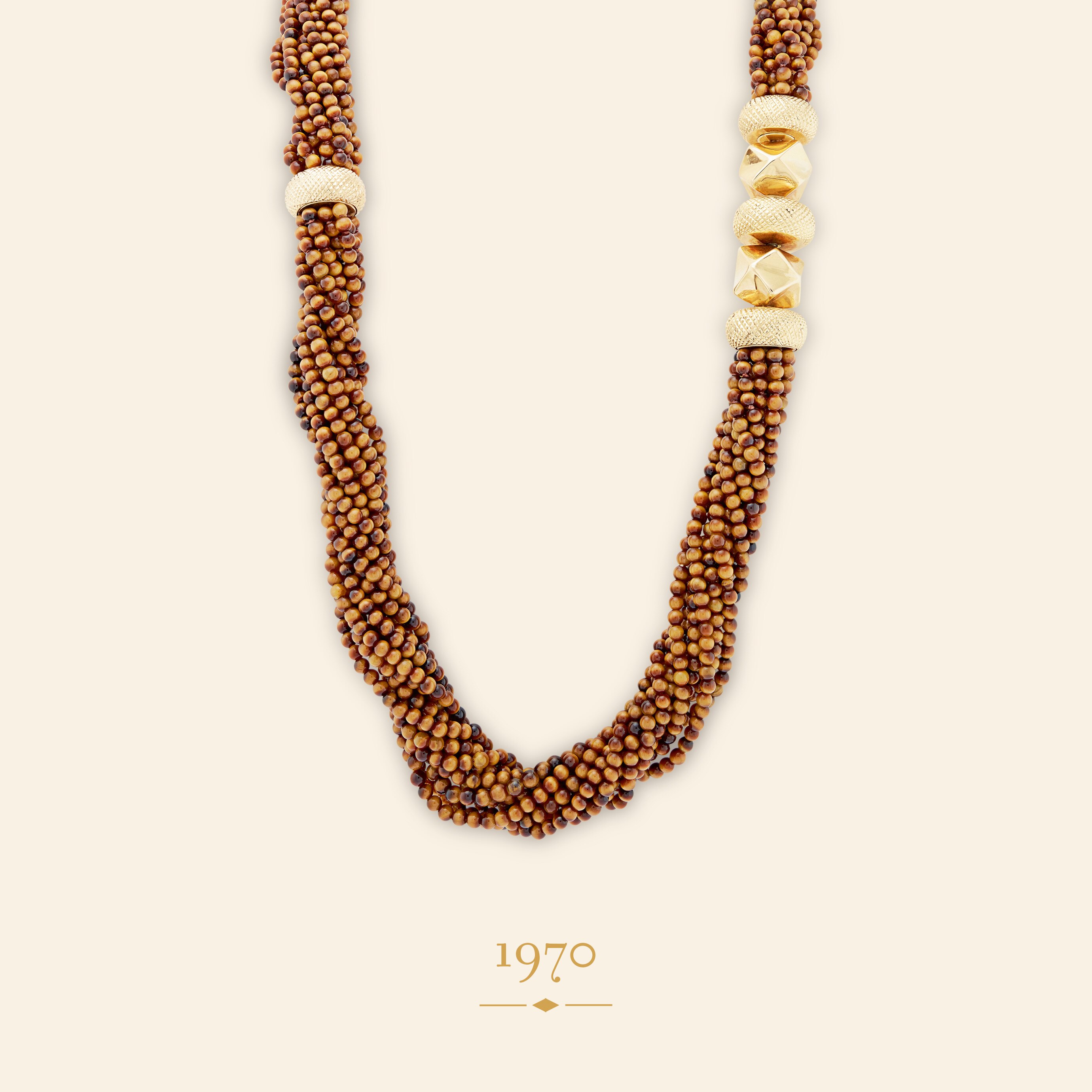 Колье Crisscross, 1970 год. Желтое золото 18 карат, тигровый глаз. Коллекция Van Cleef & Arpels.