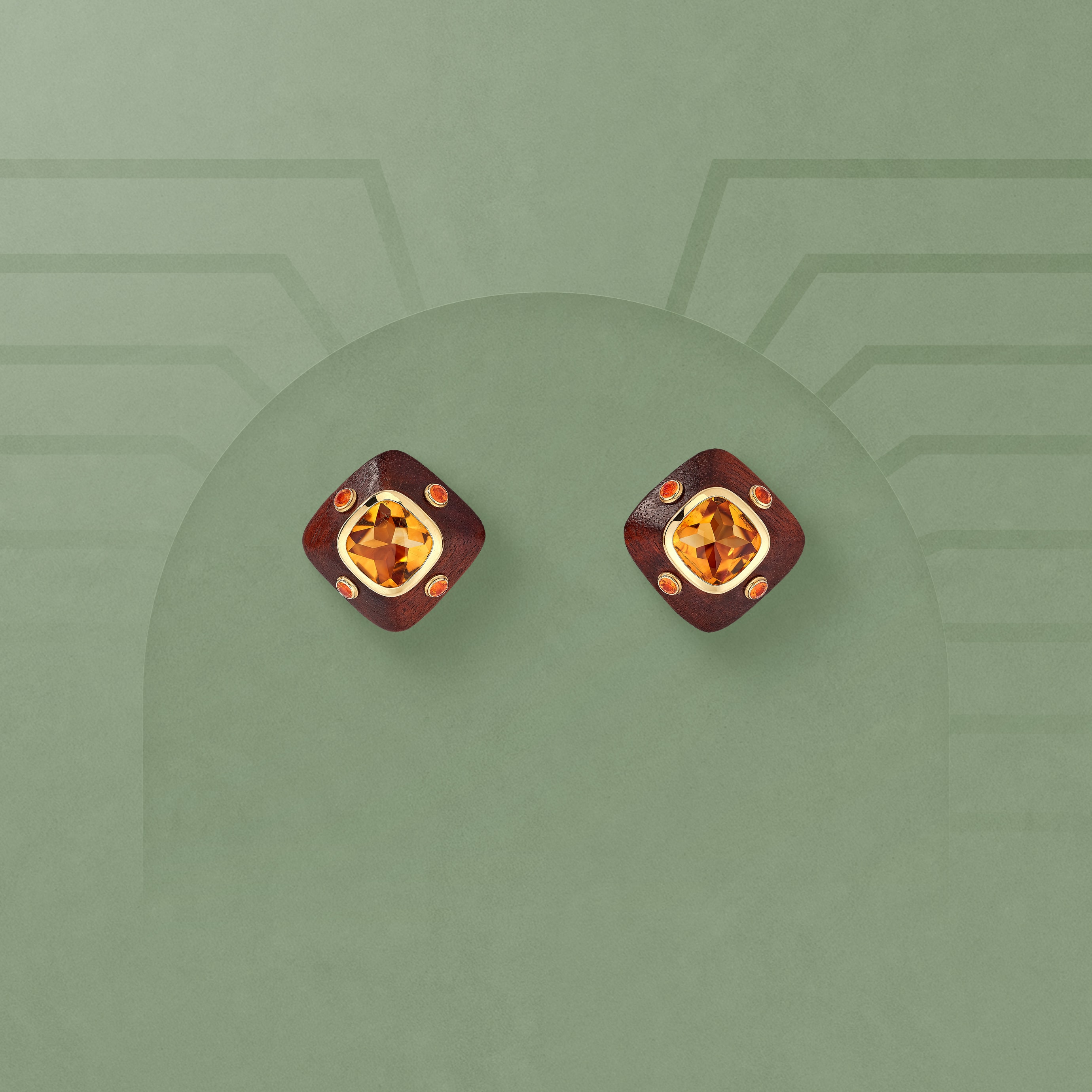 Émotions earrings, 1997. Yellow gold, citrines, garnets, wood. Van Cleef & Arpels Collection.