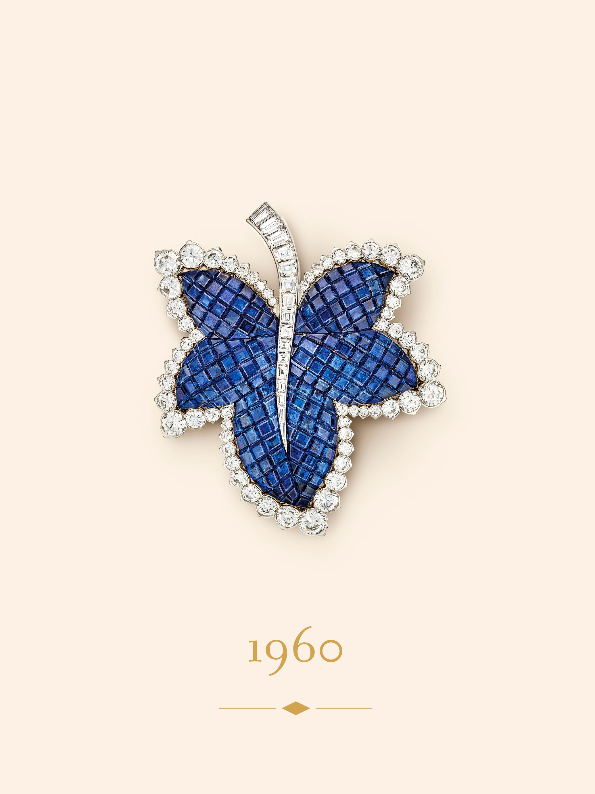 Feuille de platane clip, 1960. Platinum, yellow gold, Mystery Set sapphires, diamonds. Van Cleef & Arpels Collection.
