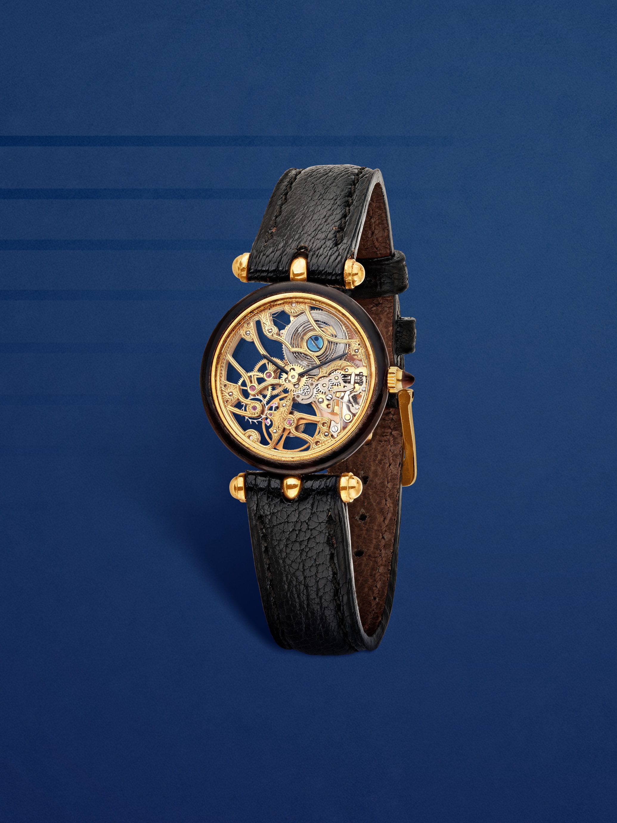 PA49 skeleton wristwatch, 1979. Yellow gold, rubies, tortoiseshell, leather. Van Cleef & Arpels Collection.