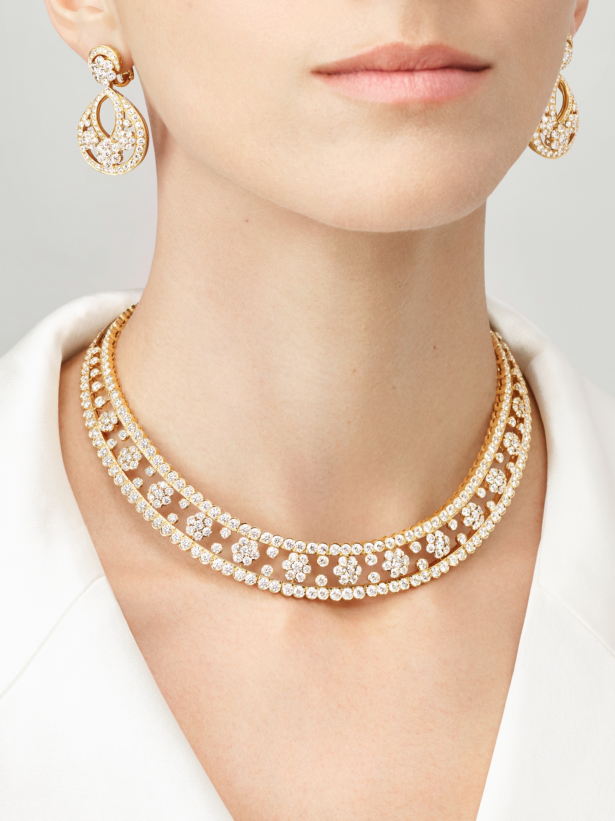 Snowflake earrings and necklace, 18K yellow gold, diamonds. Snowflake High Jewelry Collection, Van Cleef & Arpels.