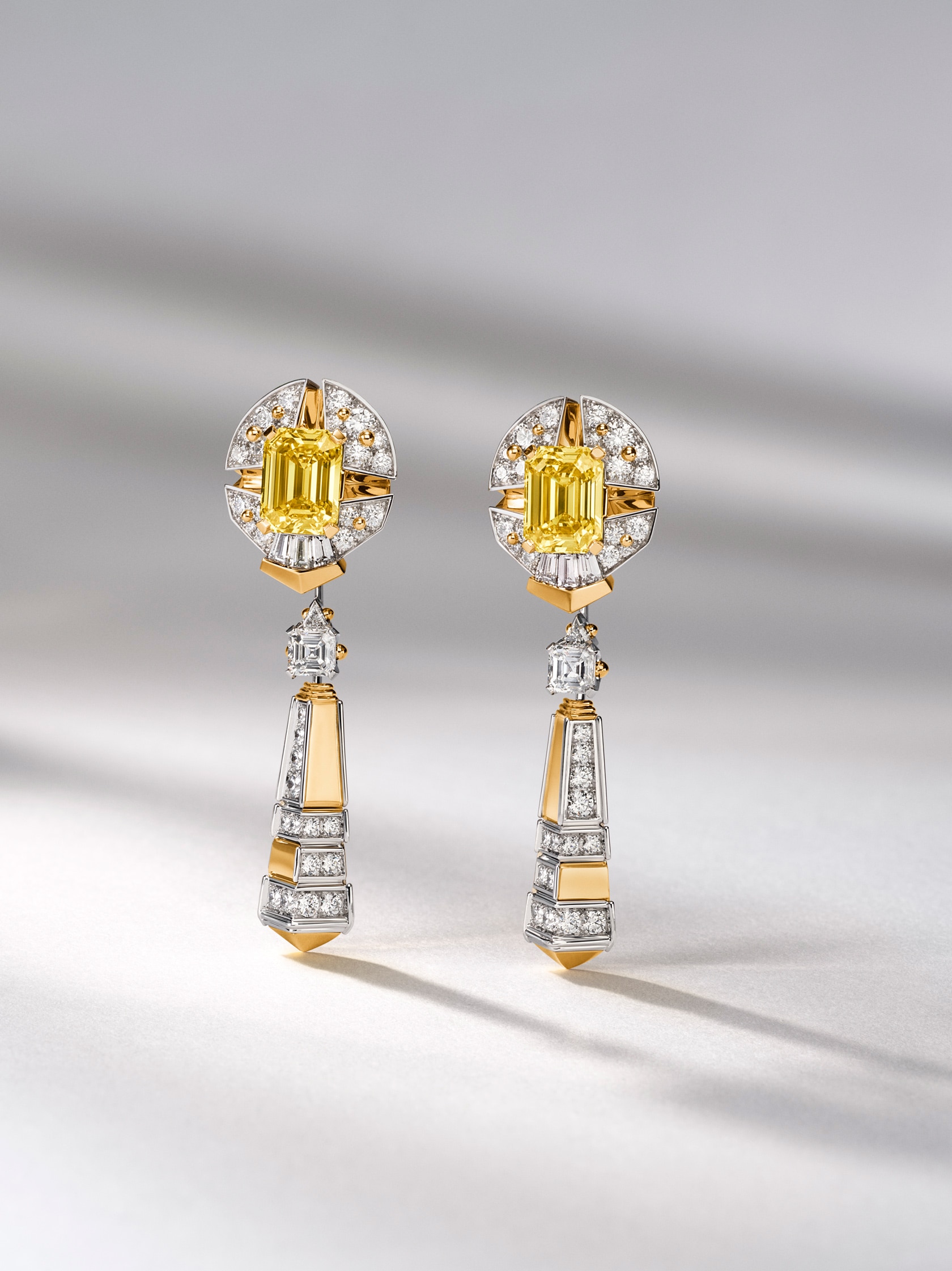 Sagesse rayonnante earrings, detachable pendants, yellow gold, white gold, emerald-cut Fancy Vivid Yellow diamonds of 3.13 and 3.03 carats, diamonds. Pierres de Caractère collection, Van Cleef & Arpels.