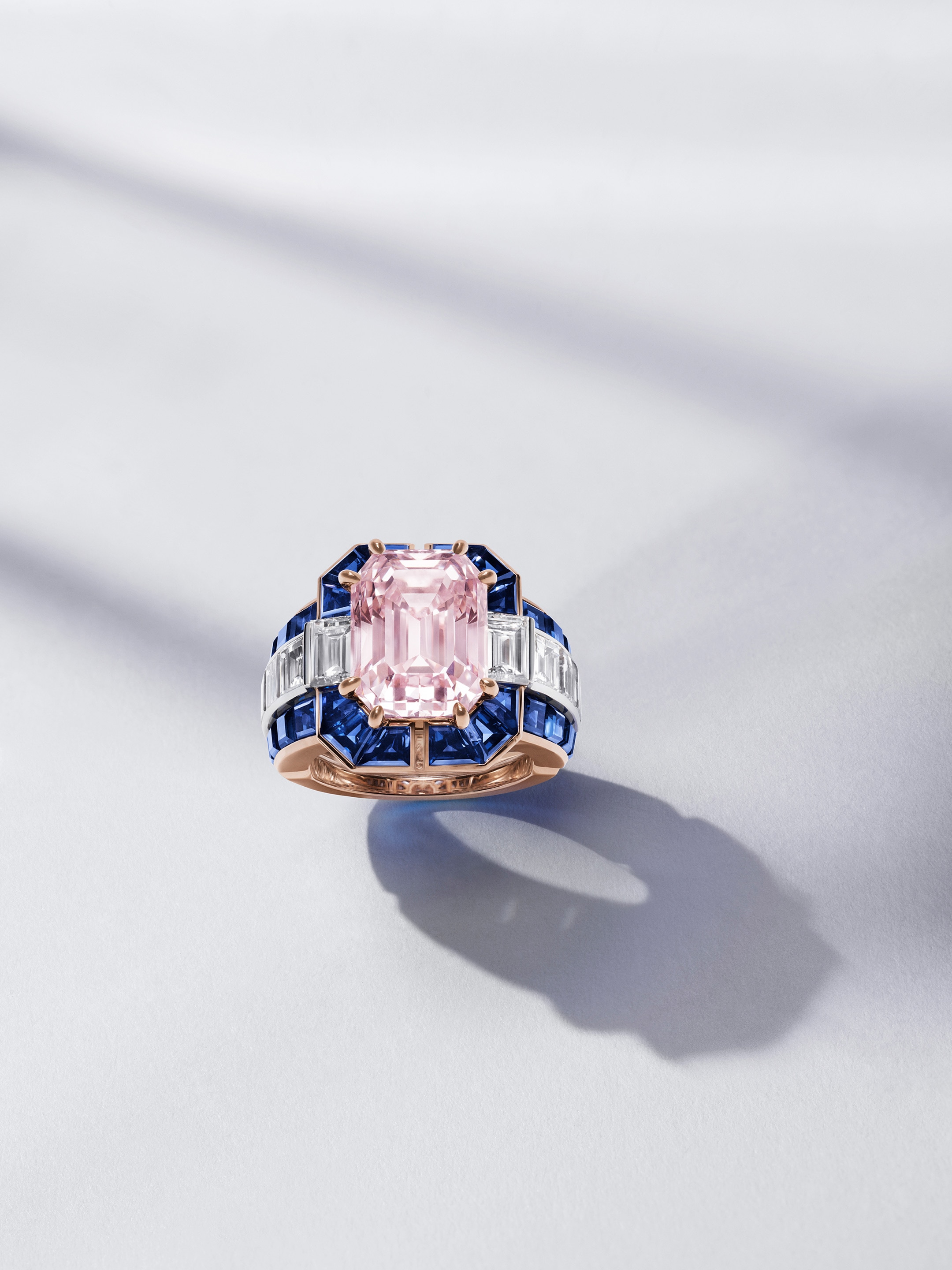 Élégance rose ring, rose gold, white gold, emerald-cut Fancy Intense Pink diamond of 8.71 carats, sapphires, diamonds. Pierres de Caractère collection, Van Cleef & Arpels.
