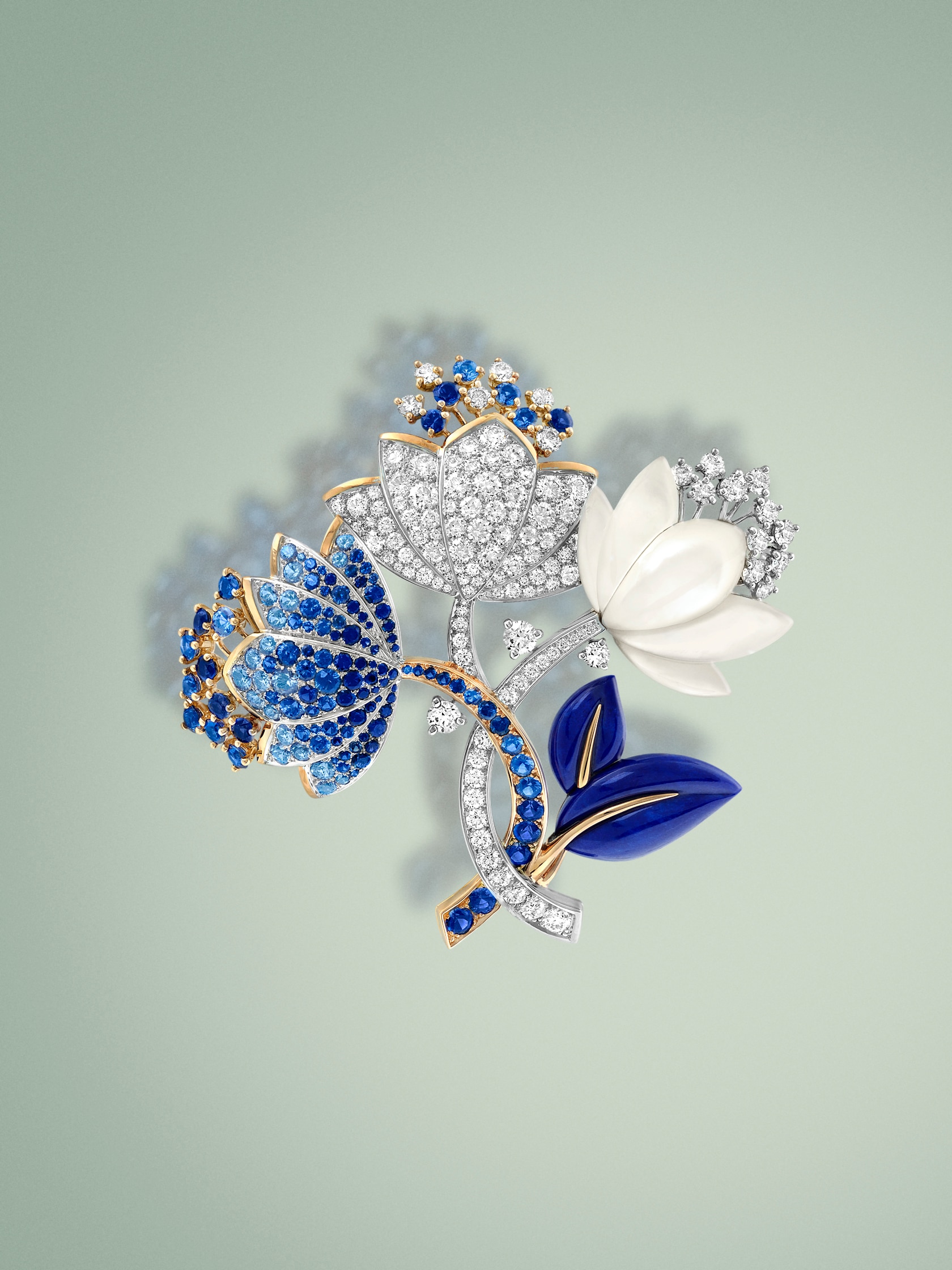 Amaryllis clip. 18K rose gold, 18K white gold, sapphires, white mother-of-pearl, lapis-lazuli, diamonds.. Flowers collection, Van Cleef & Arpels.
