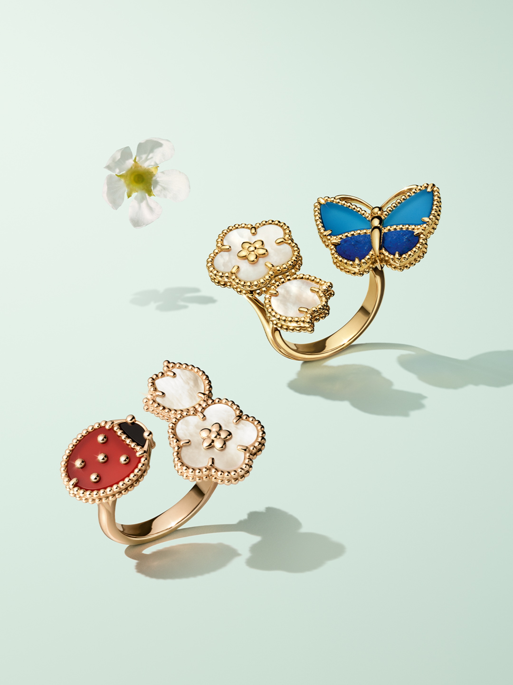 Lucky Spring Butterfly Between the Finger ring, 18K yellow gold, lapis lazuli, blue agate, white mother-of-Lucky Spring Between the Finger ring, 18K rose gold, carnelian, mother-of-pearl, onyx. Lucky Spring® collection, Van Cleef & Arpels.