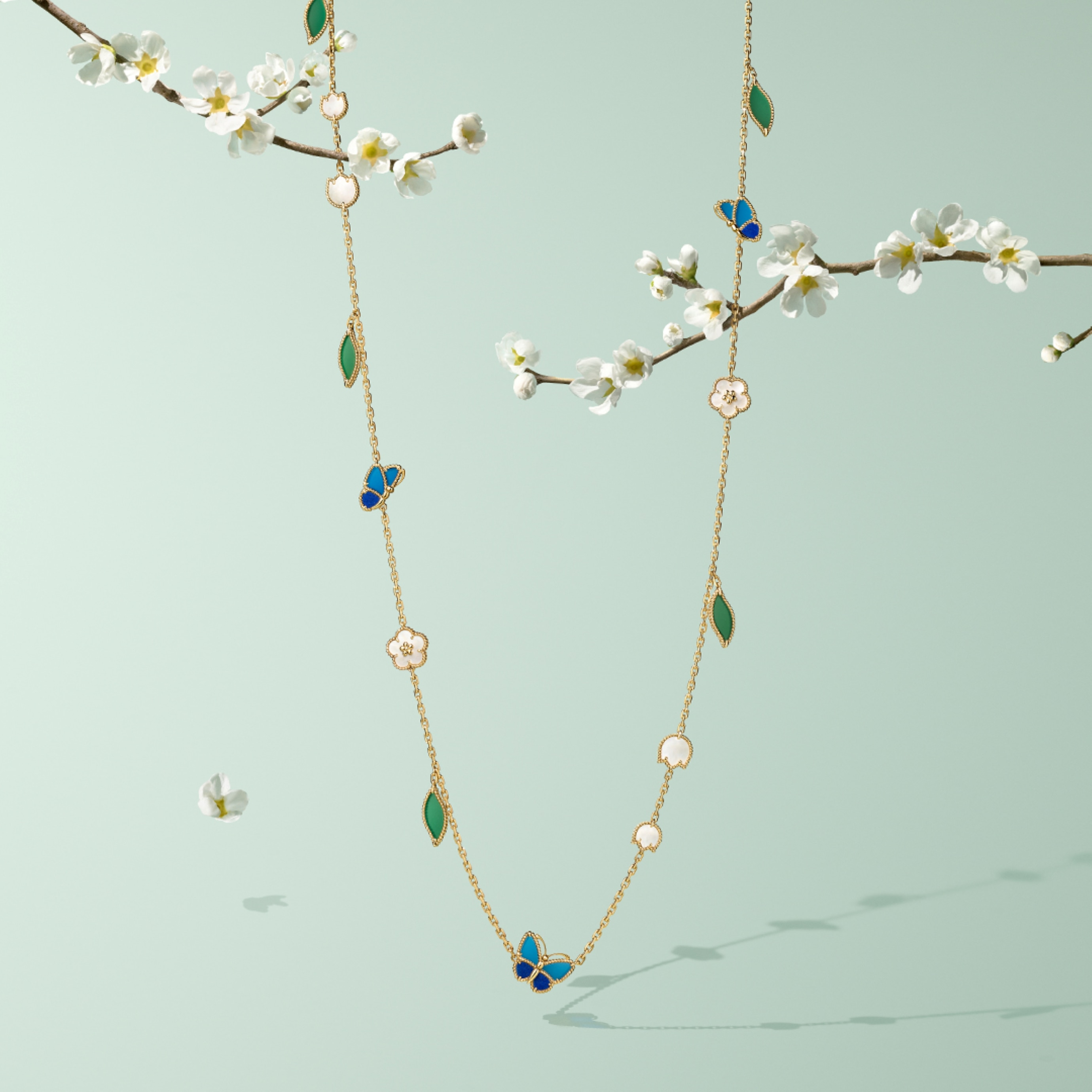 Lucky Spring Butterfly long necklace, 15 motifs, 18K yellow gold, lapis lazuli, blue and green agate, white mother-of-pearl. Lucky Spring® collection, Van Cleef & Arpels.