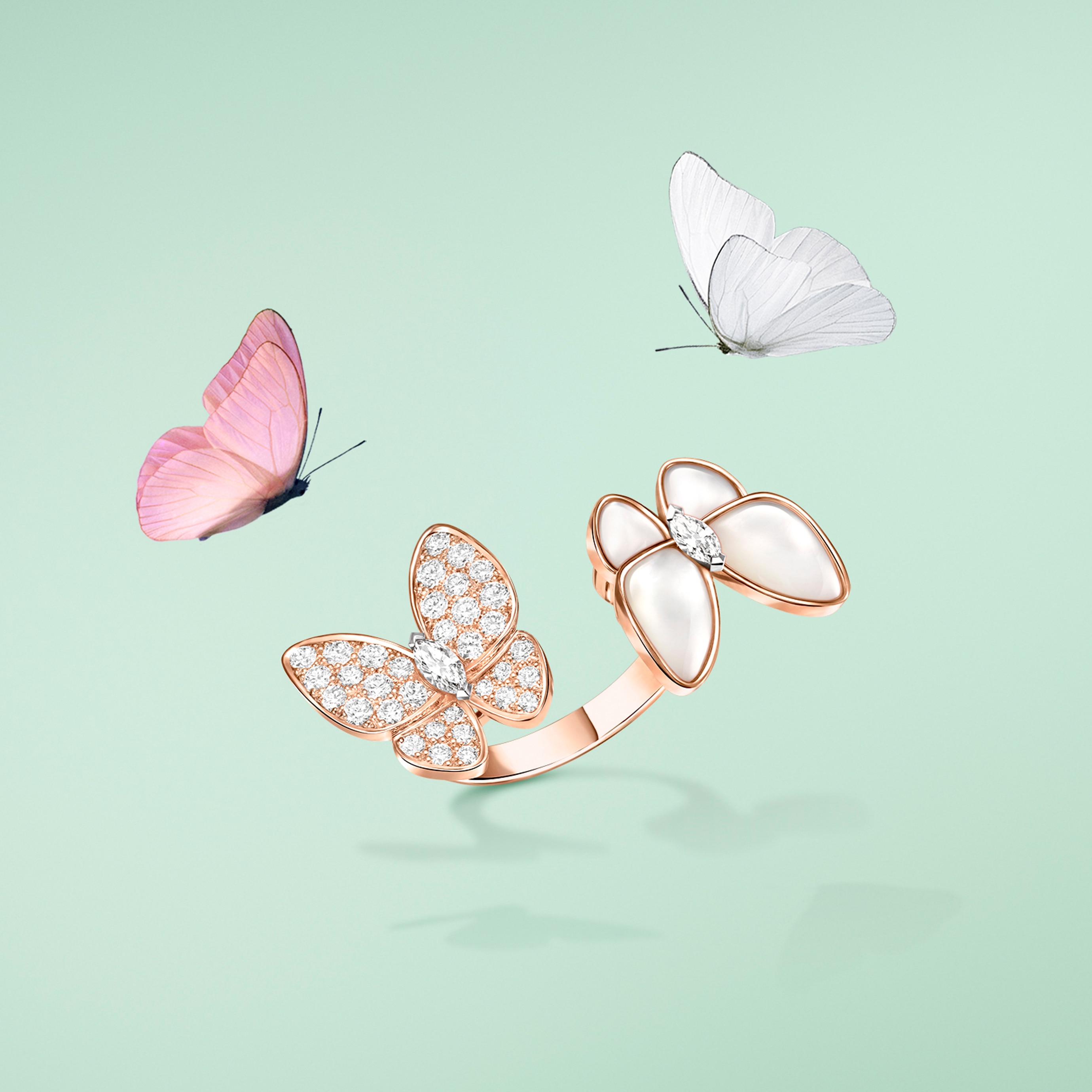 Between the Finger ring™, 18K rose gold, rhodium plated 18K white gold, coral, diamonds. Two Butterfly collection, Van Cleef & Arpels.