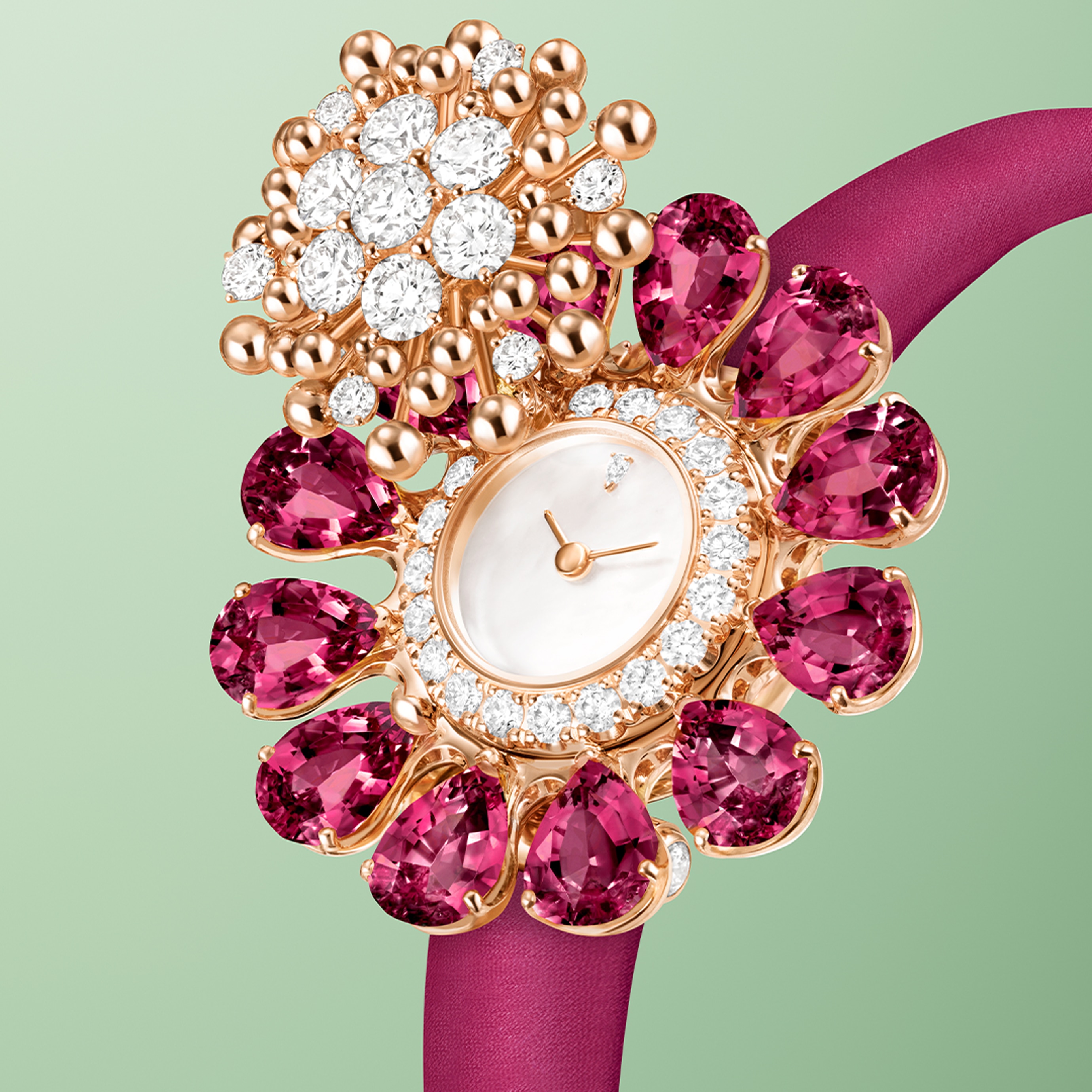 Fleurs d’Hawaï secret watch, rose gold, rhodolites, white mother-of-pearl, diamonds, Swiss quartz movement. Fleurs d'Hawaï collection, Van Cleef & Arpels.
