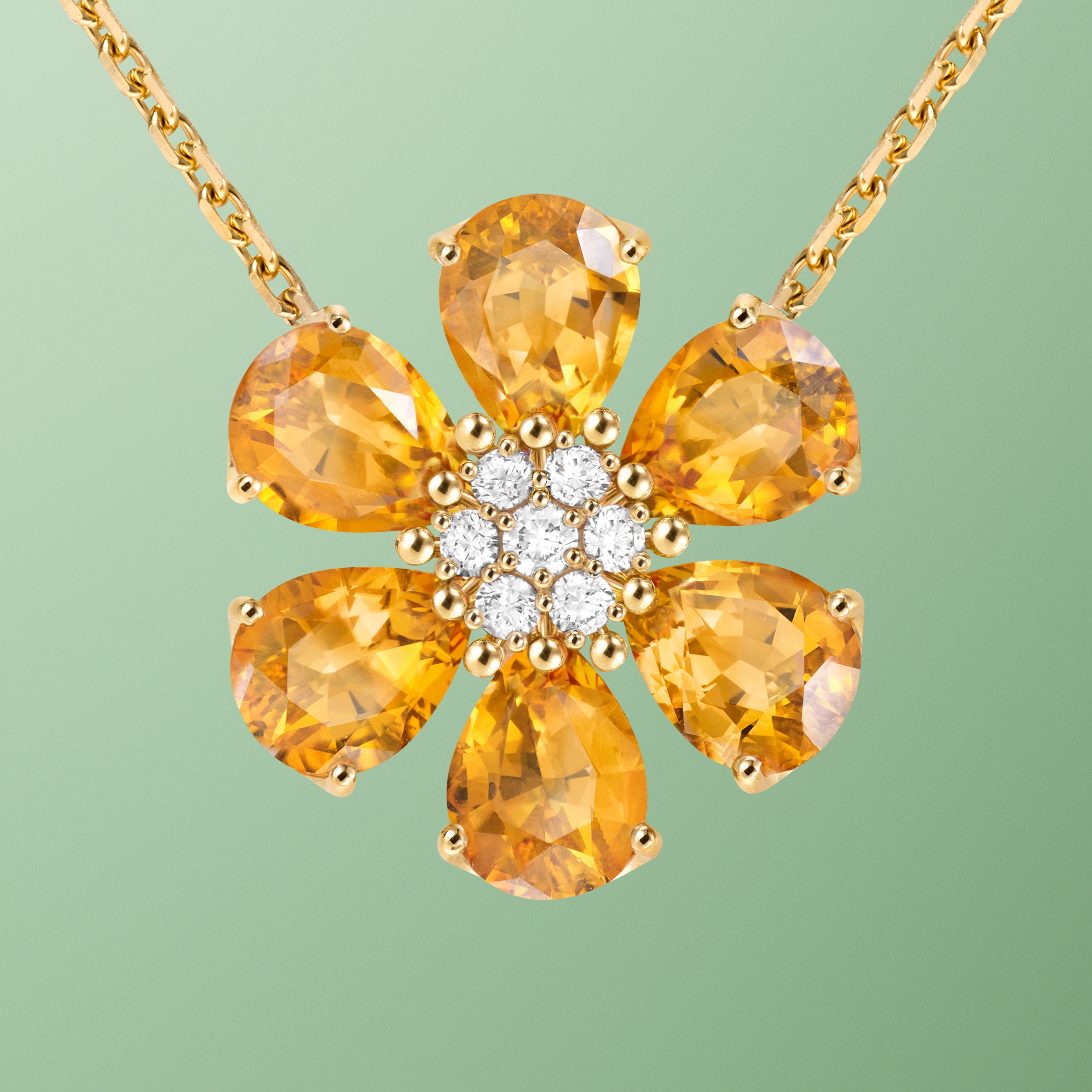 Fleurs d’Hawaï pendant, medium model, yellow gold, citrines, diamonds. Fleurs d’Hawaï collection, Van Cleef & Arpels.