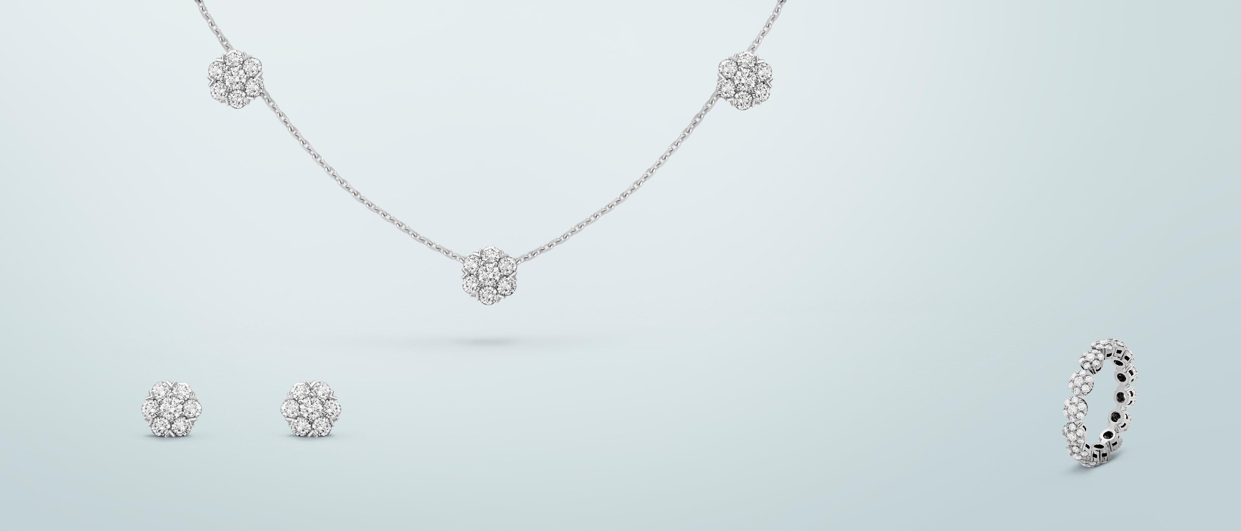 Fleurette earrings, white gold, round diamonds, Fleurette necklace 5 flowers, white gold, round diamonds and Fleurette wedding band, platinum, round diamonds. Fleurette collection, Van Cleef & Arpels.