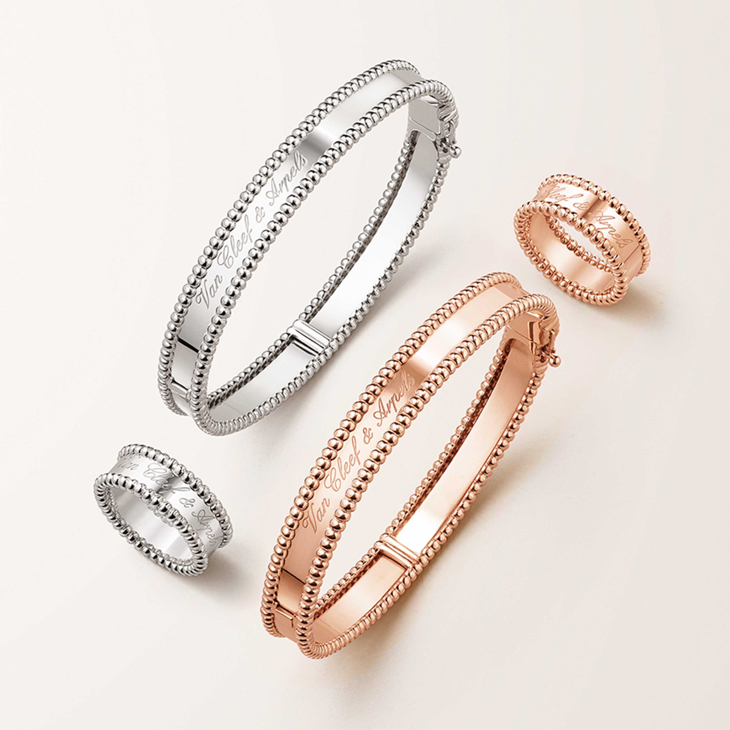 Signature bracelets and rings, 18K rose gold and rhodium plated 18K white gold. Perlée collection, Van Cleef & Arpels.