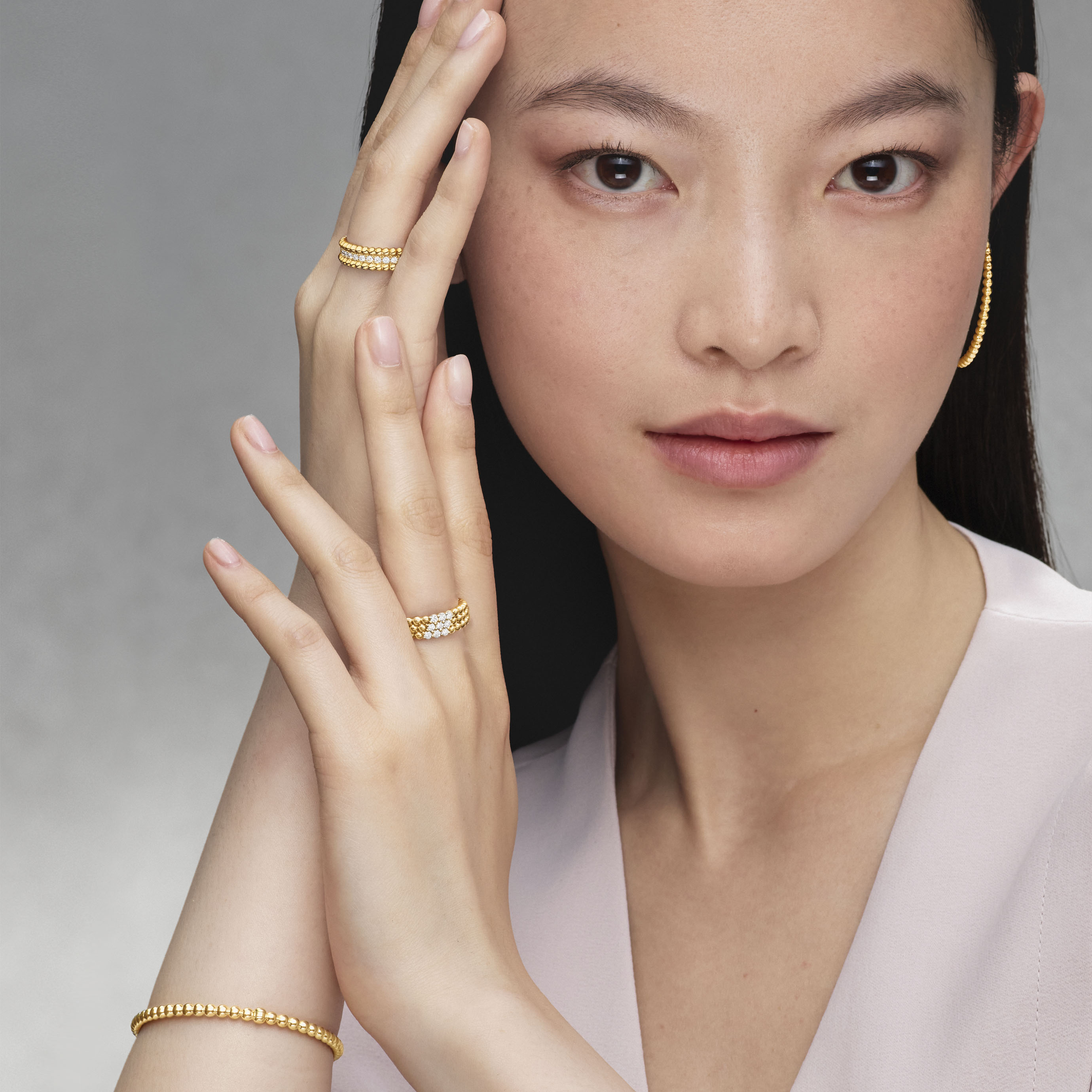 Diamonds rings, 3 rows, and 1 row, diamonds, pearls of gold bracelet, diamonds bracelet, 5 rows, diamonds, pearls of gold hoop earrings, 18K yellow gold. Perlée collection, Van Cleef & Arpels.