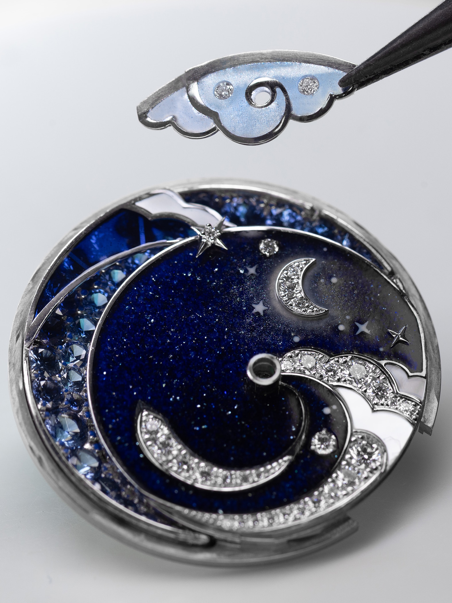 Assembling the setting in enamel cloud on the dial, Van Cleef & Arpels.