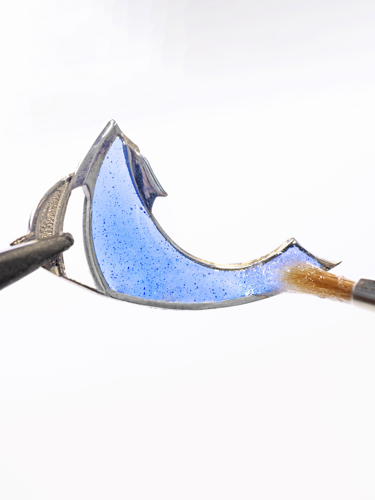 Applying plique-à-jour enamel on the robe, Van Cleef & Arpels.