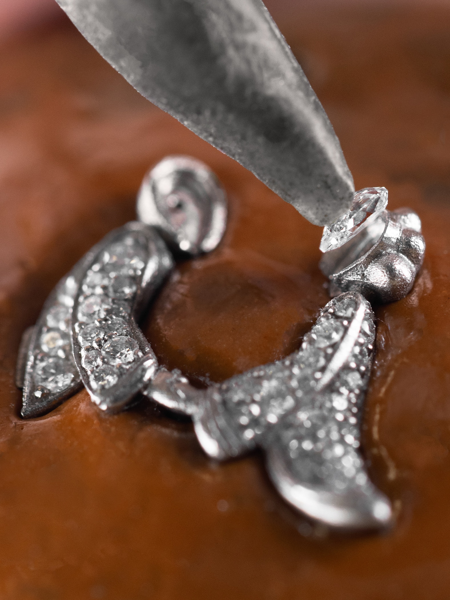 Verifying the position of the rose-cut diamond, Van Cleef & Arpels.