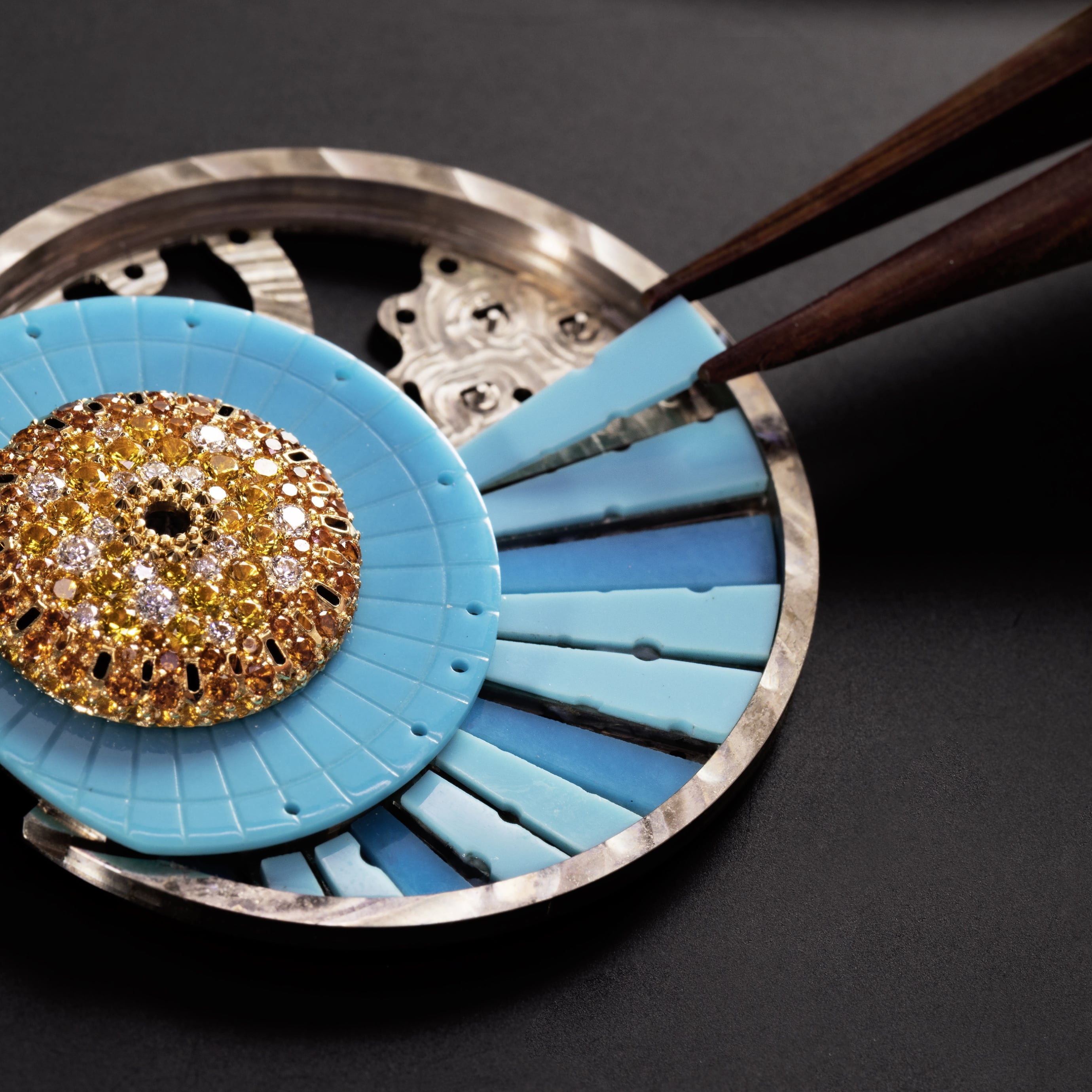 Assembling the turquoise marquetry on the dial. Lady Arpels Jour Enchanté watch, Extraordinary Dials™ collection, Van Cleef & Arpels.