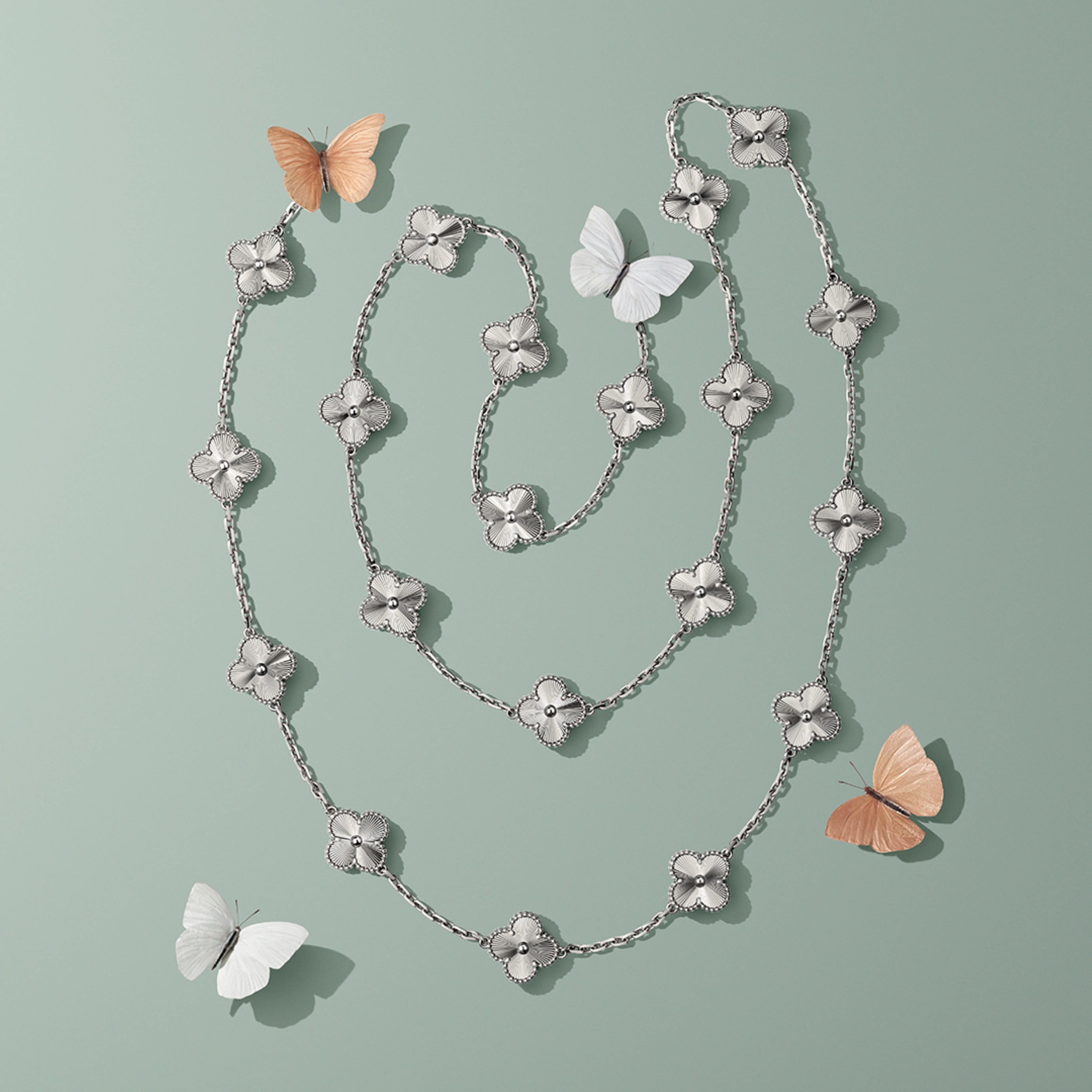 Vintage Alhambra long necklace, 20 motifs, 18K white gold. Alhambra® collection, Van Cleef & Arpels..