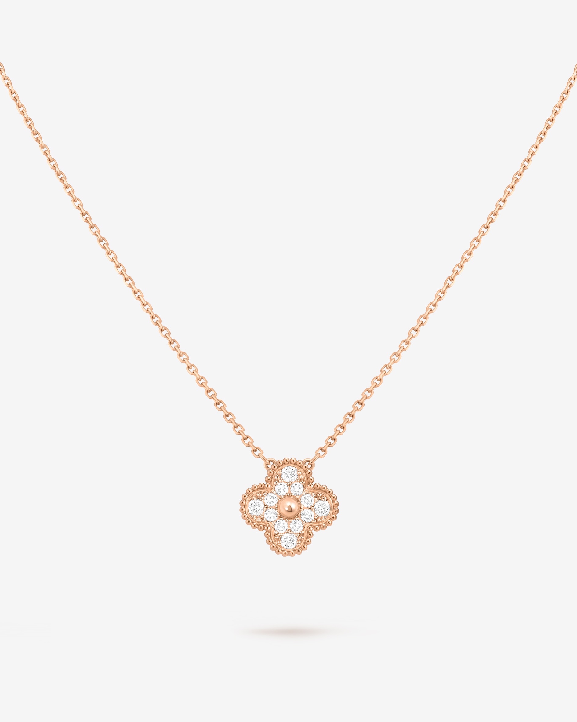 Vintage Alhambra pendant, 18K rose gold, diamond. Alhambra® collection, Van Cleef & Arpels.