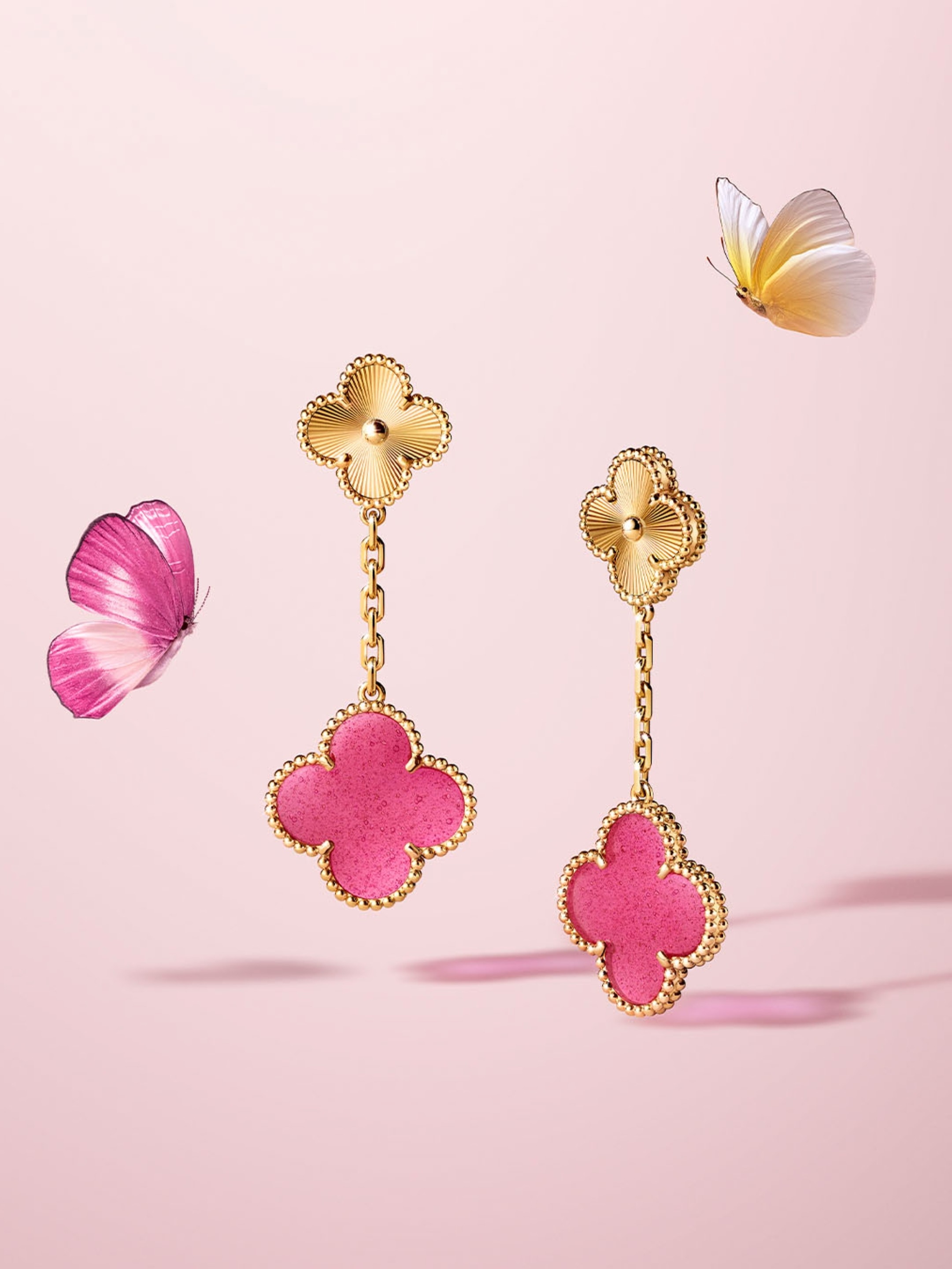 Magic Alhambra earrings, 2 motifs, guilloché yellow gold, pink enamel. Alhambra® collection, Van Cleef & Arpels.
